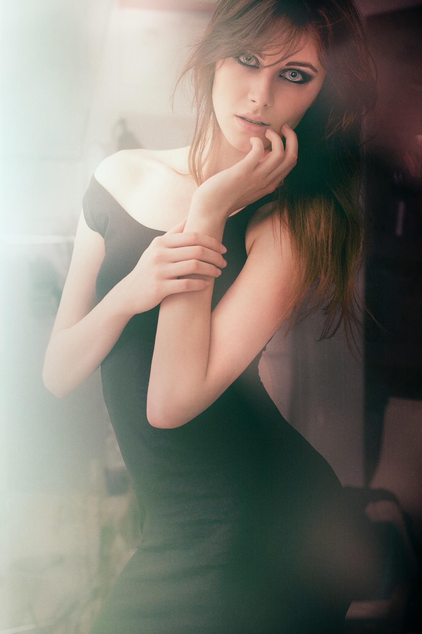Woman with long brown hair in a black dress HD Wallpaper