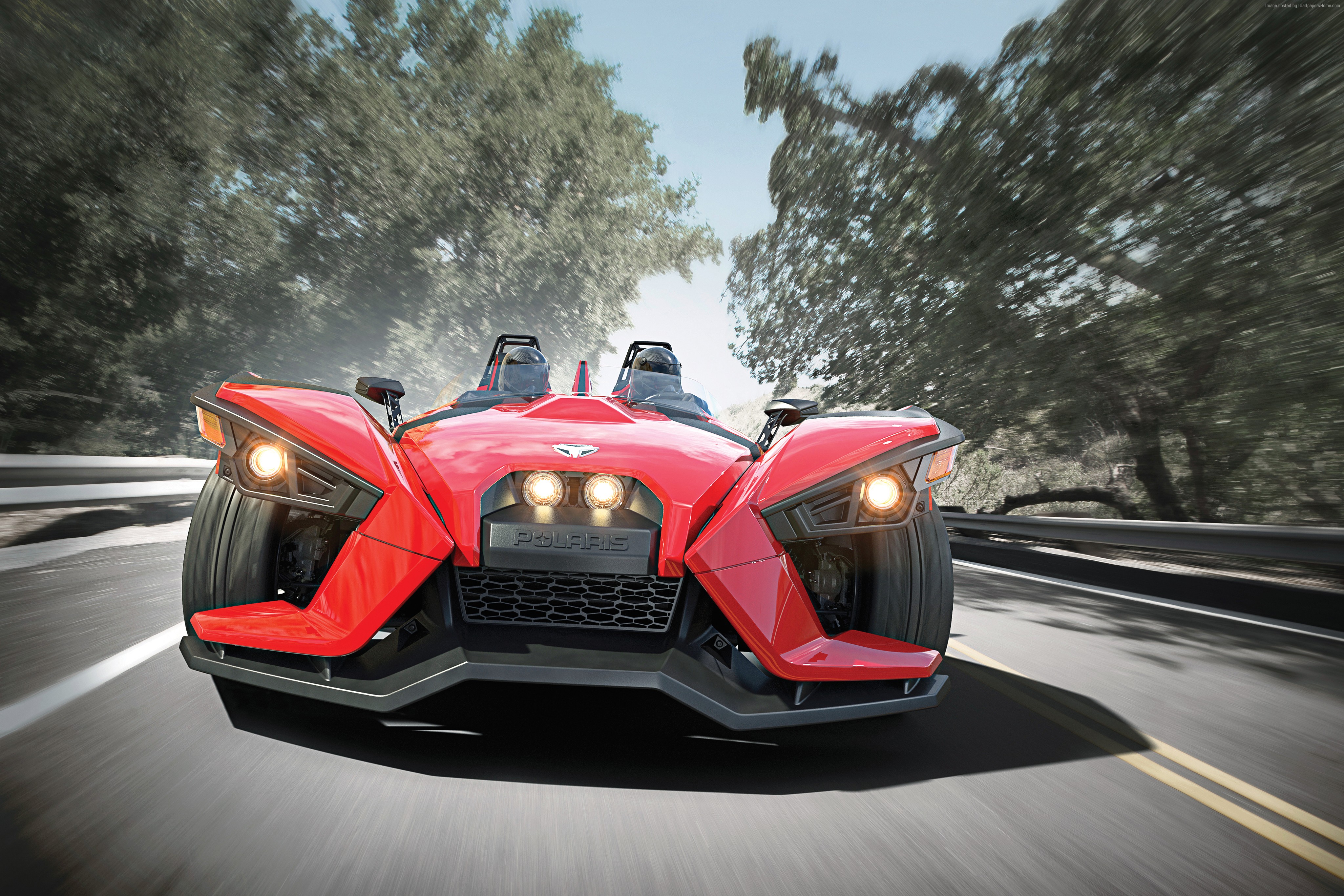 Red Polaris Slingshot driving on a road HD Wallpaper