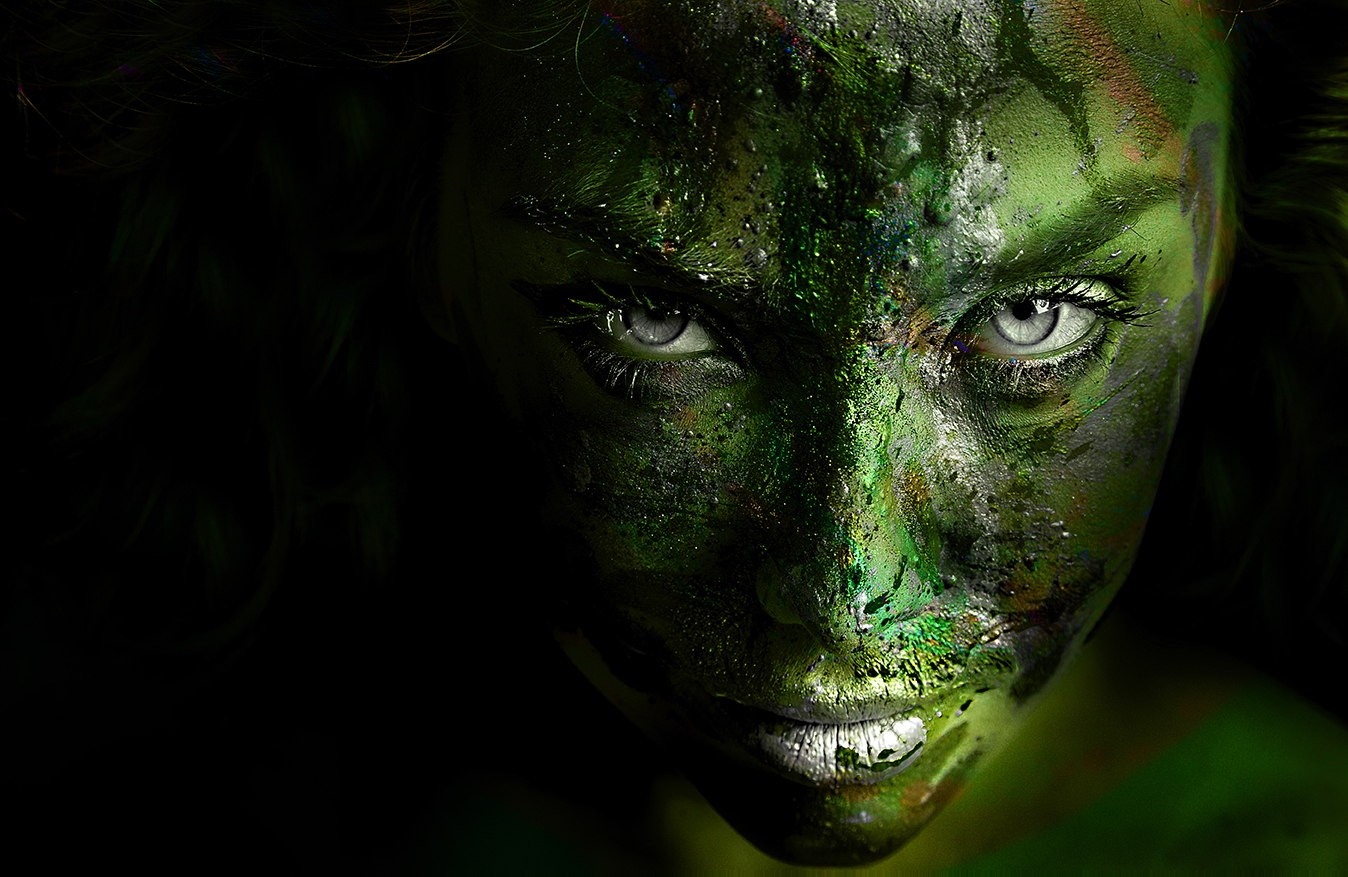 Close up of a woman with green face paint HD Wallpaper