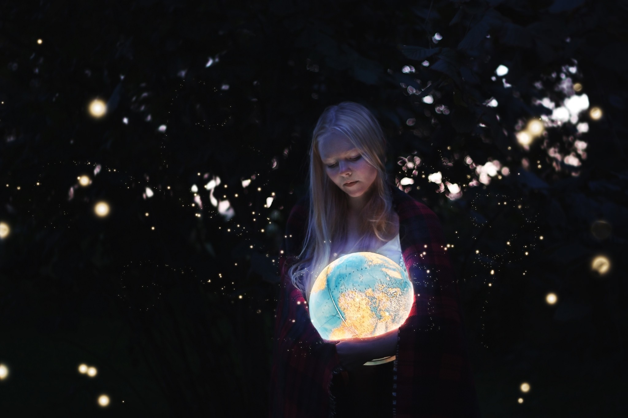 Girl holding a glowing globe at night HD Wallpaper