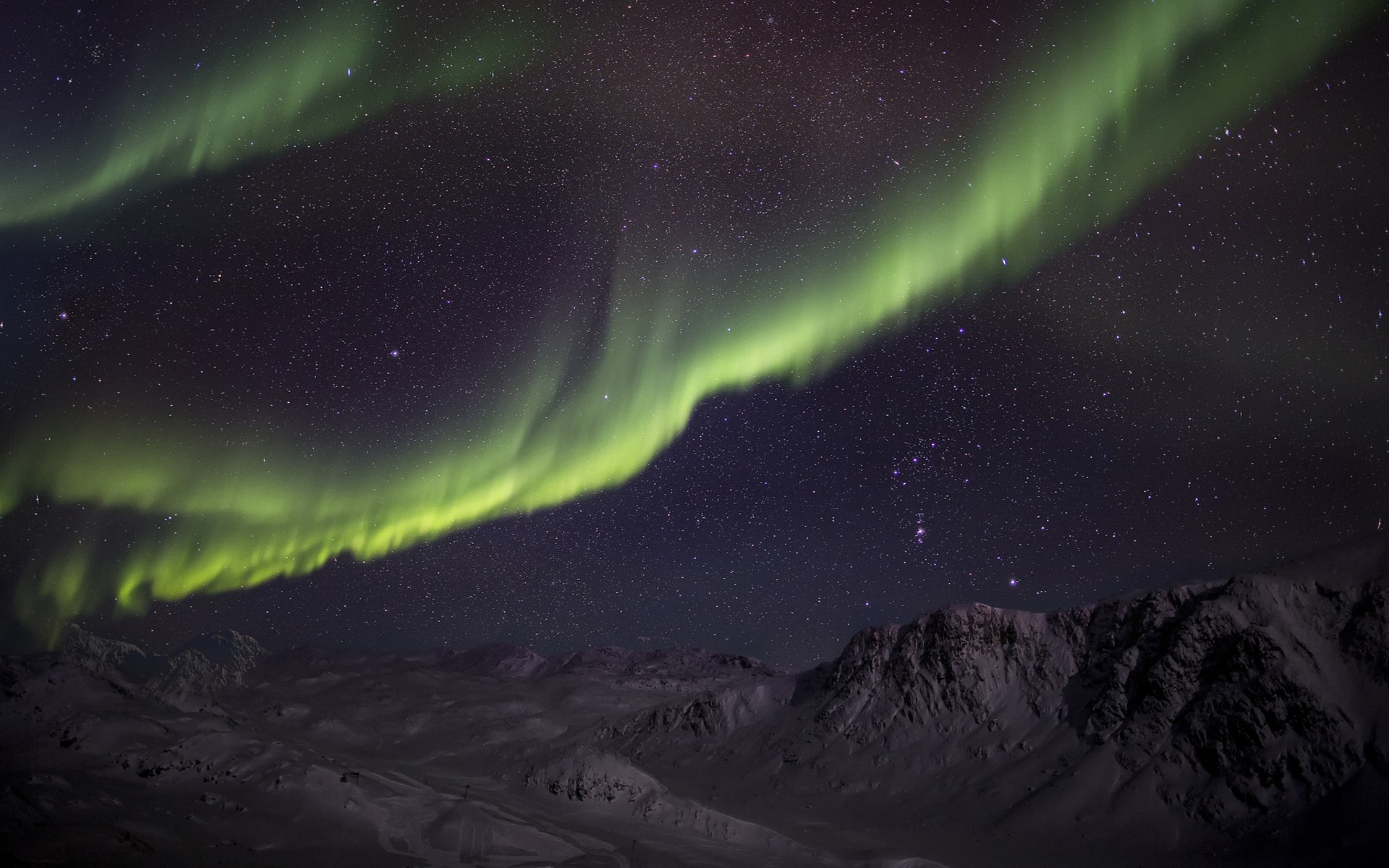 Aurora Borealis over snow-covered mountains HD Wallpaper