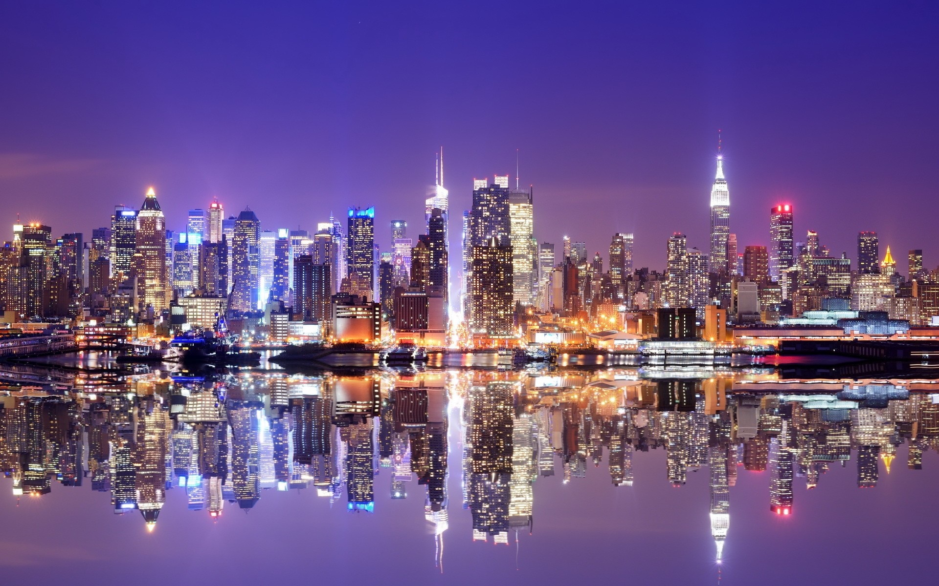 New York City skyline at night with reflections HD Wallpaper