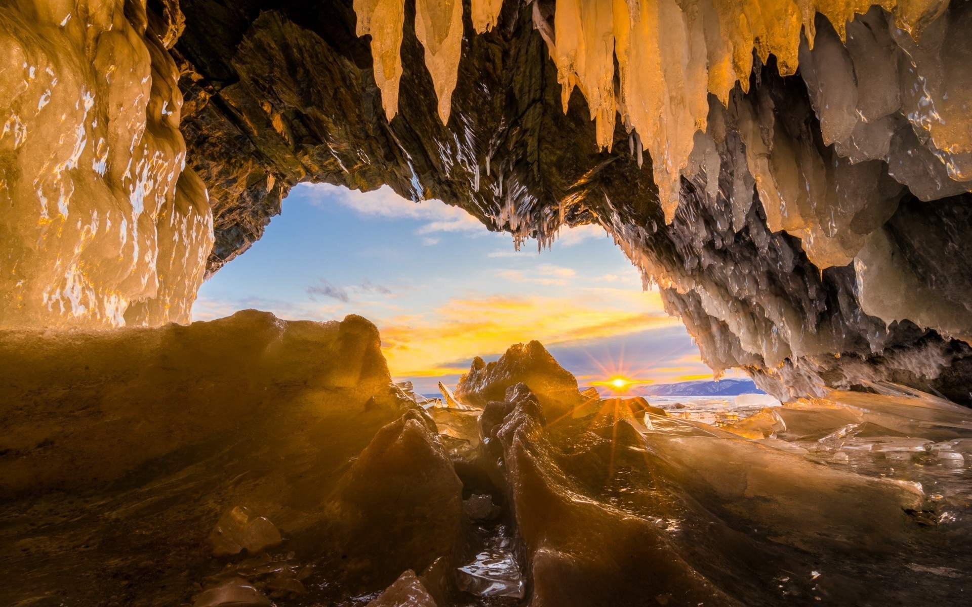Ice cave with sunset view HD Wallpaper
