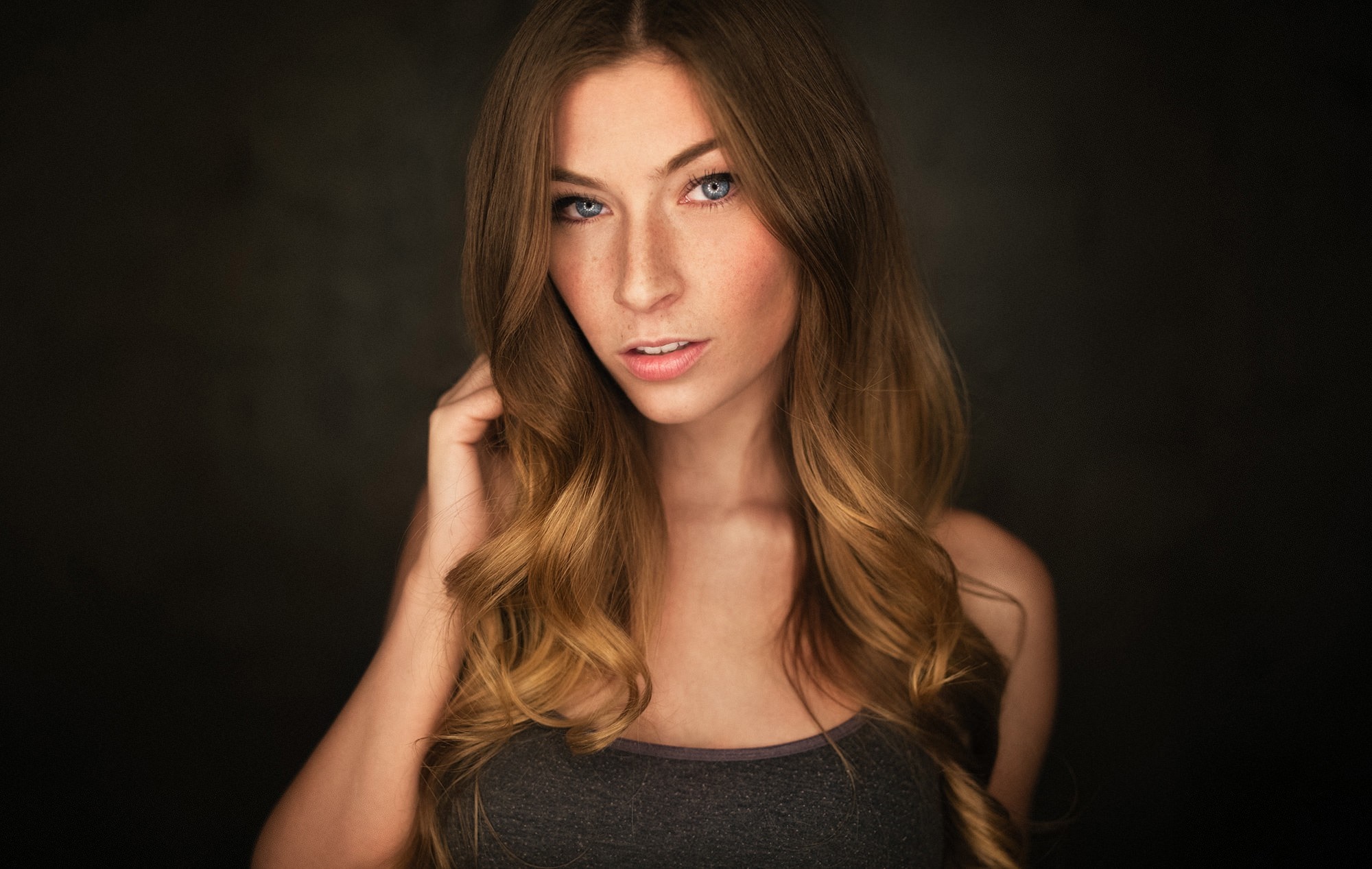 Woman with long wavy brown hair and blue eyes HD Wallpaper