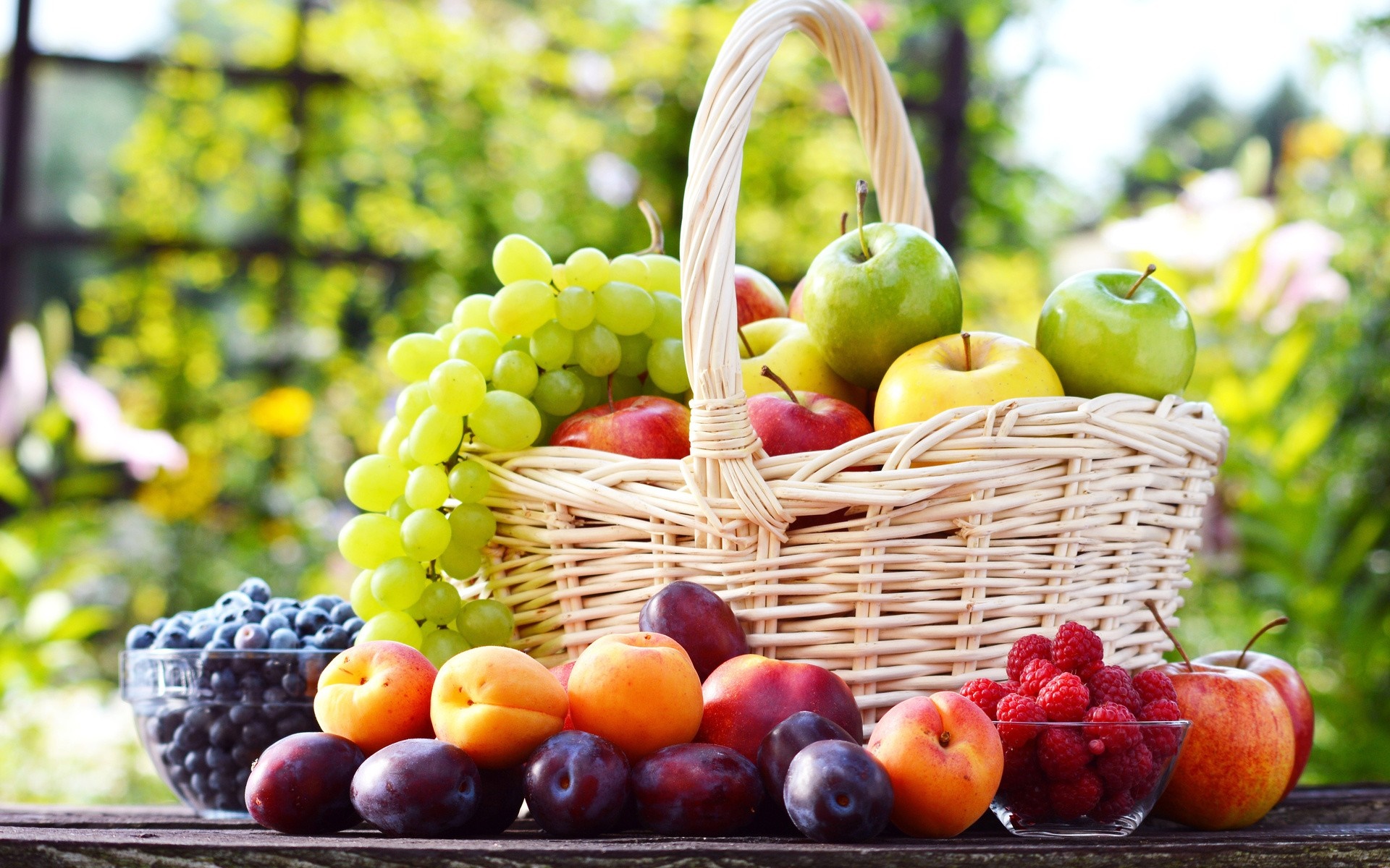 Basket of fresh fruits and berries outdoors HD Wallpaper
