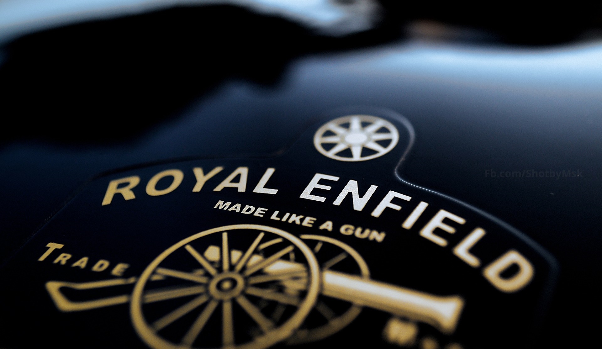 Royal Enfield logo with cannon and wheel HD Wallpaper