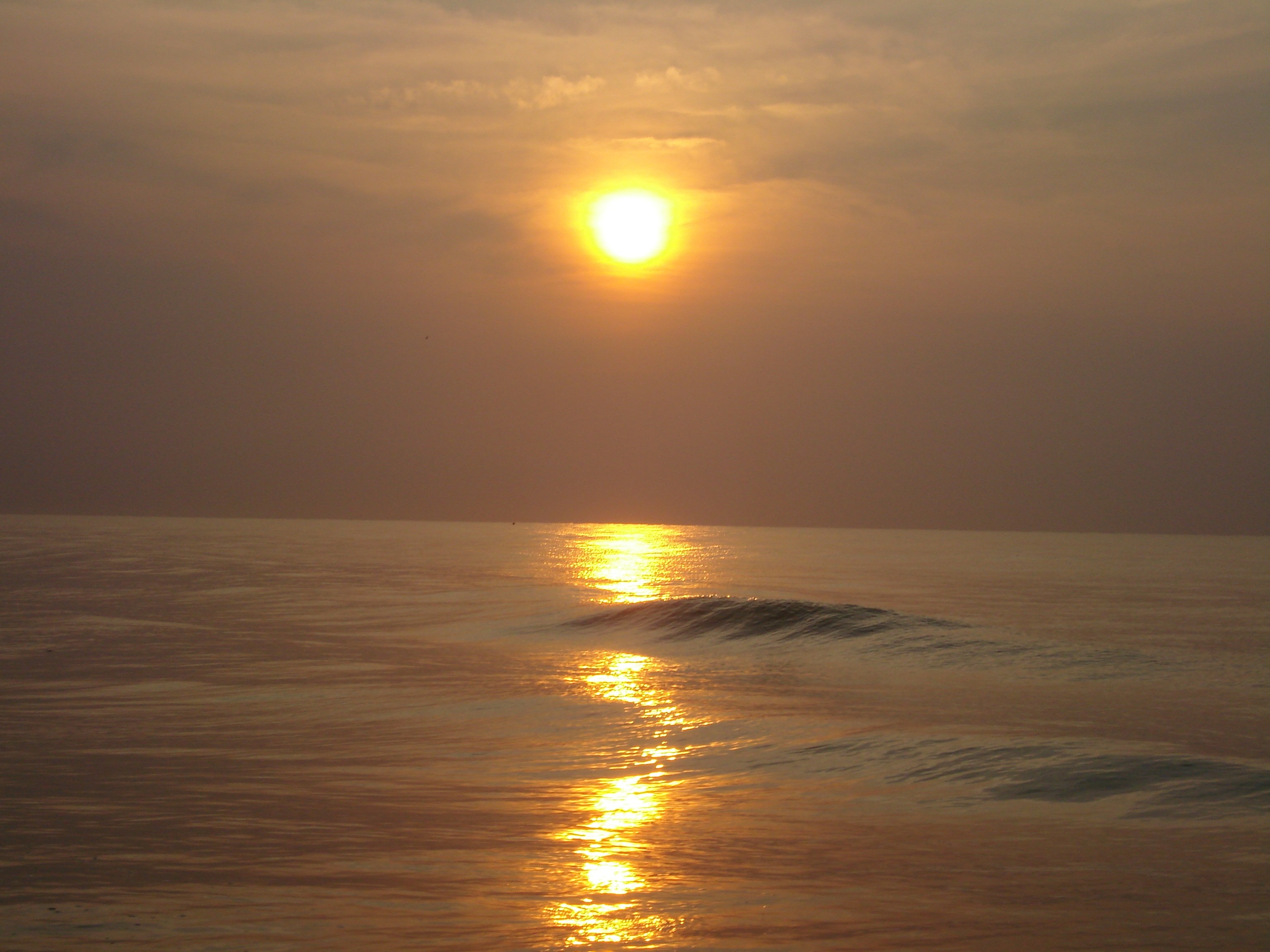 Sunset over the ocean with reflection HD Wallpaper