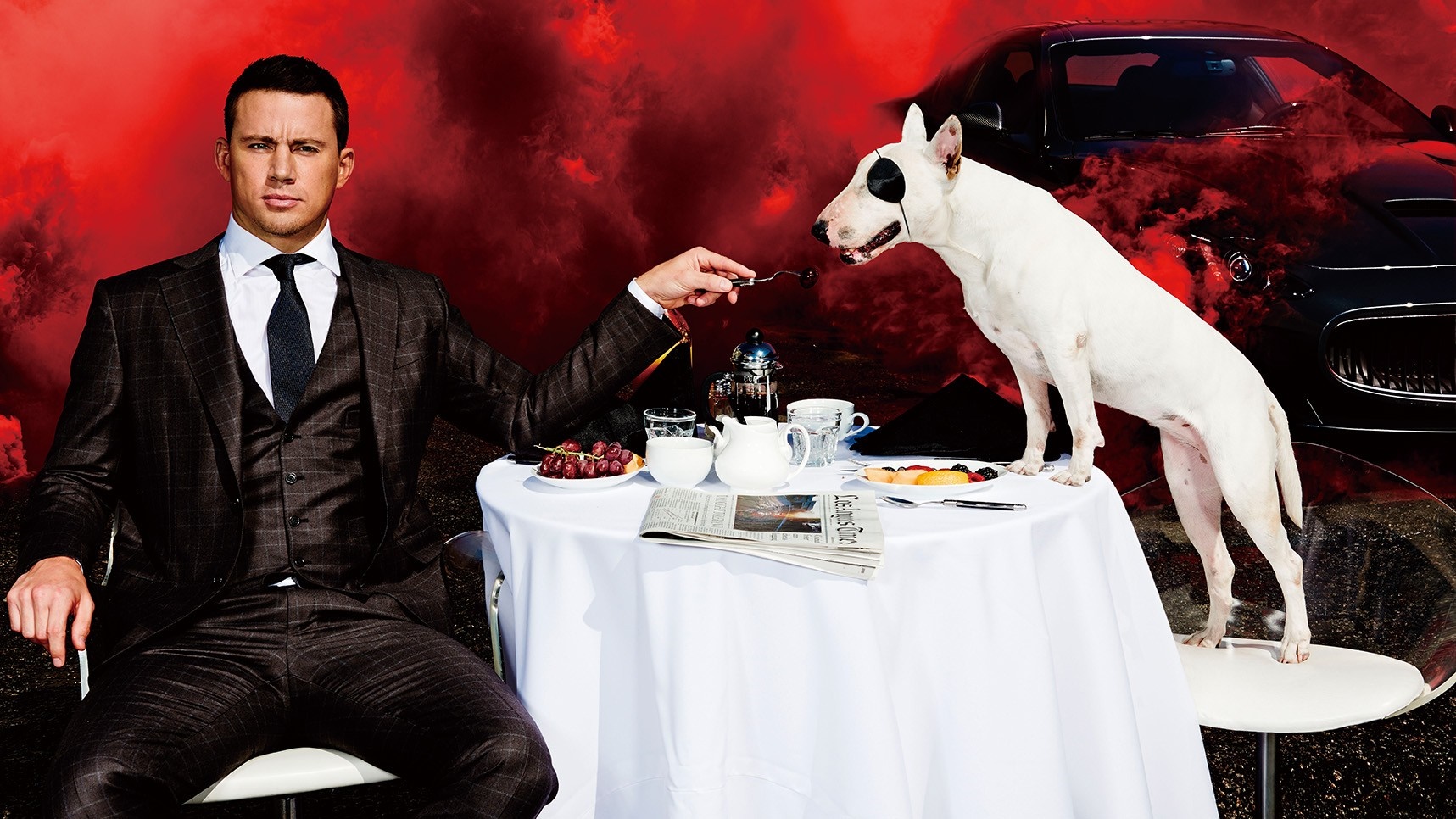Channing Tatum and dog at a table with a car HD Wallpaper