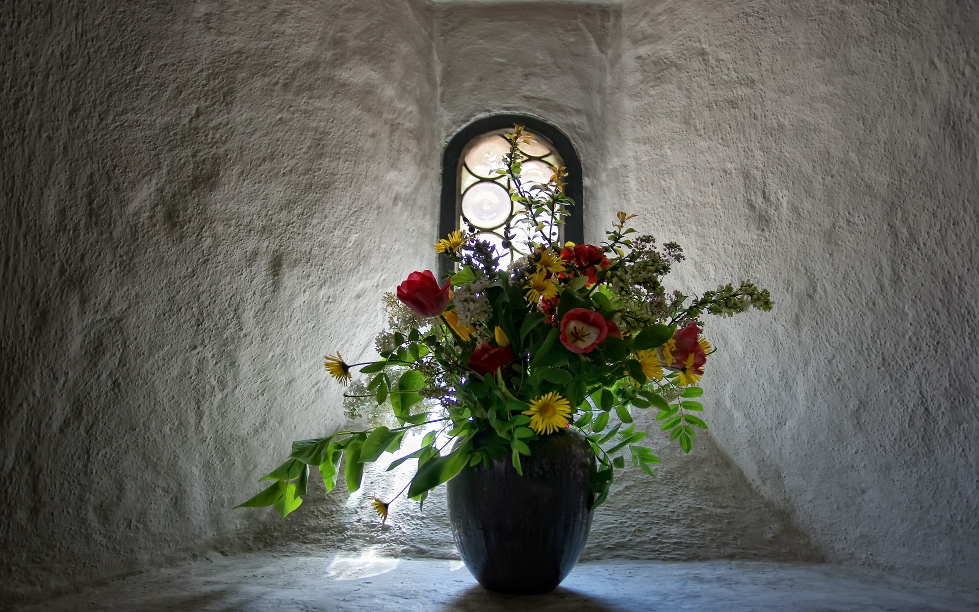Bouquet of flowers in a vase by a window HD Wallpaper