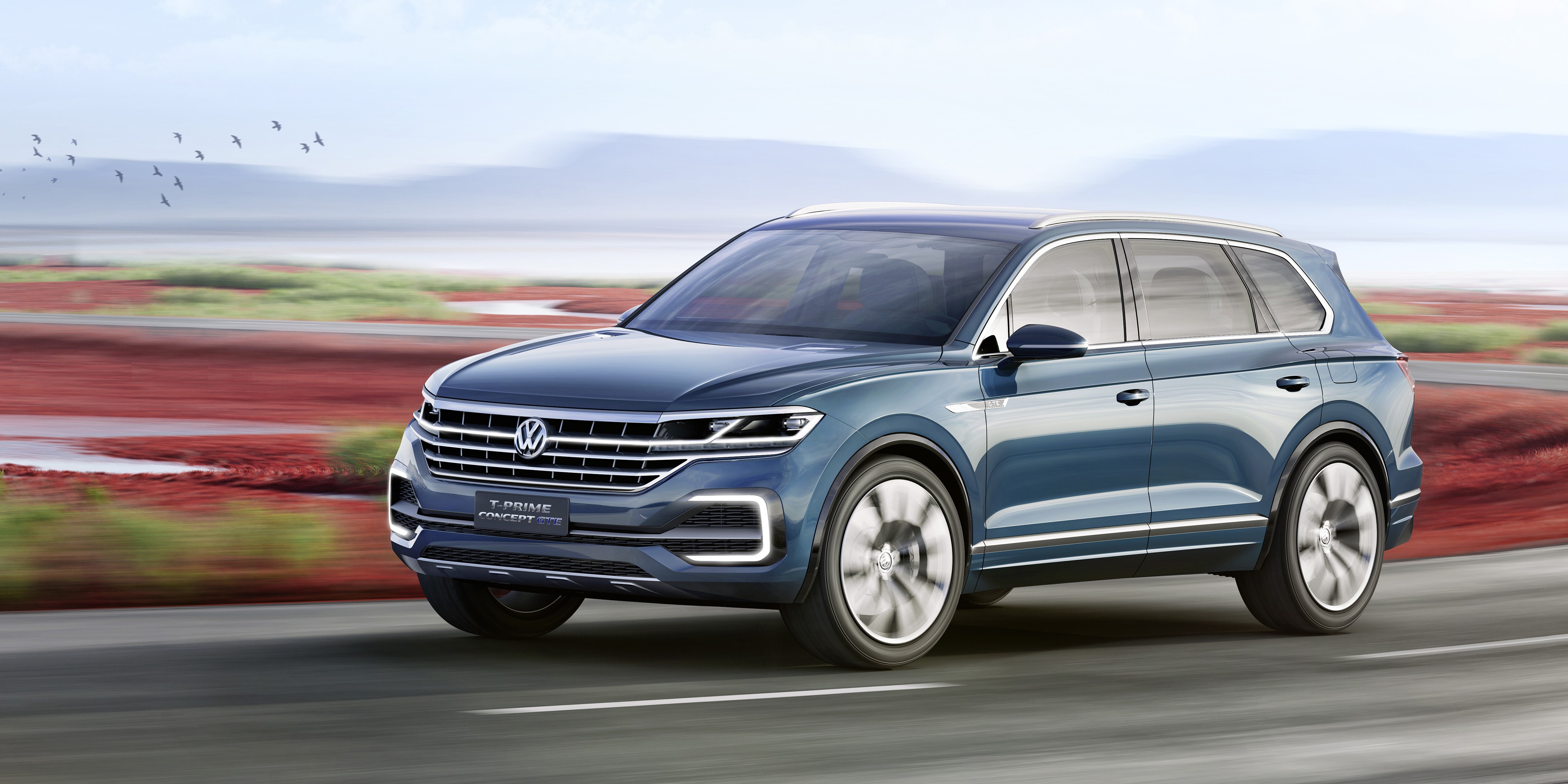 Volkswagen T-Prime GTE Concept SUV driving on road HD Wallpaper