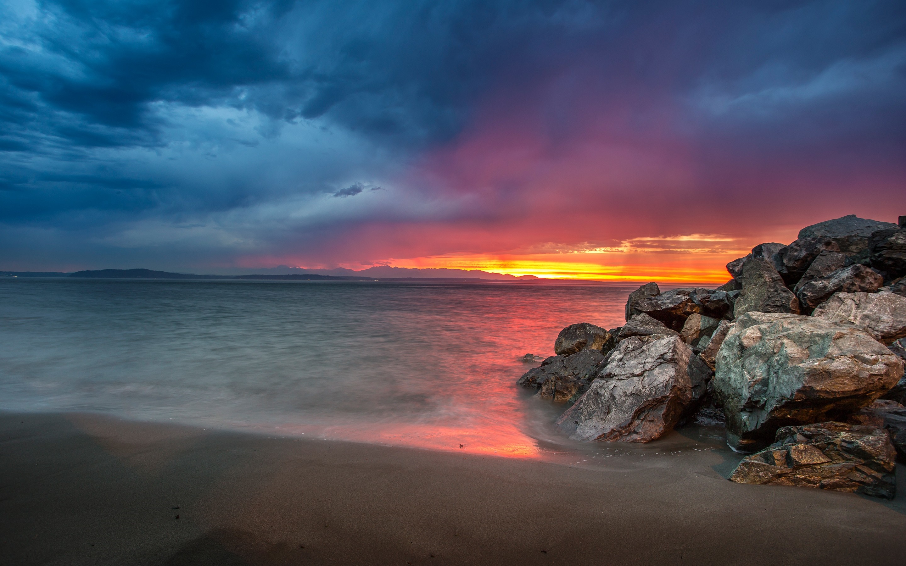 Sunset over the sea with rocks and clouds HD Wallpaper
