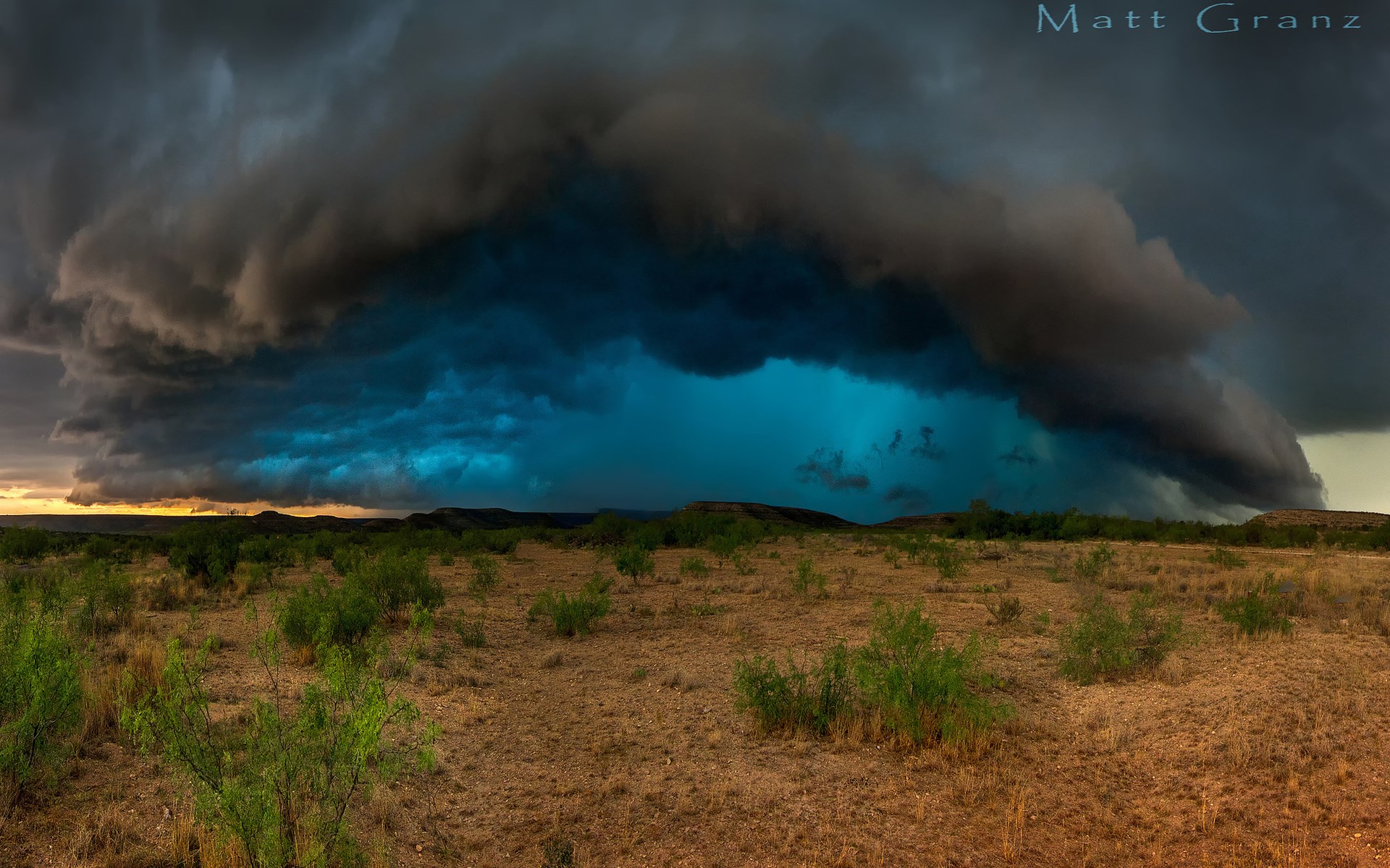 Storm clouds over a dry landscape HD Wallpaper