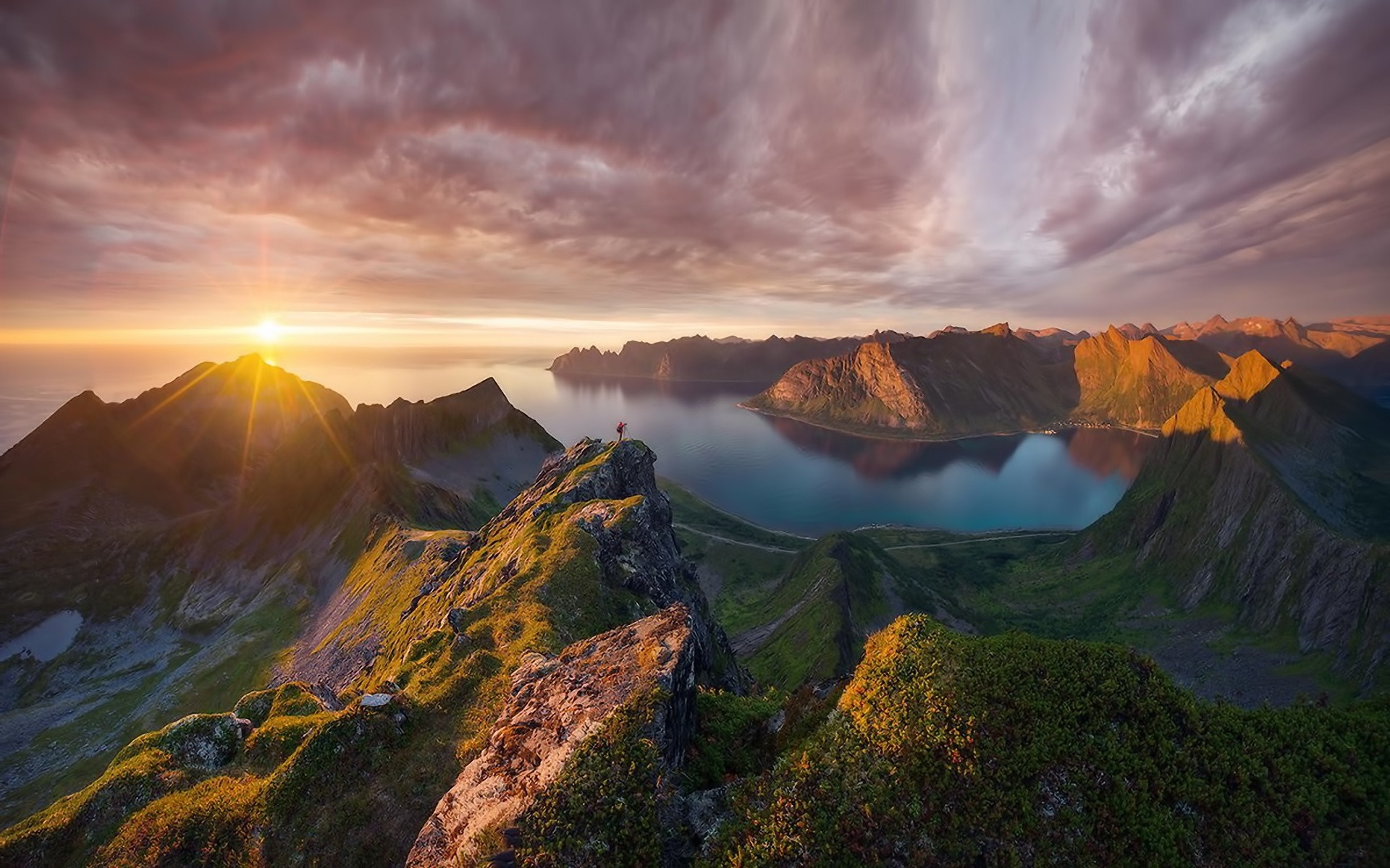 Mountain landscape with sun setting over the ocean HD Wallpaper