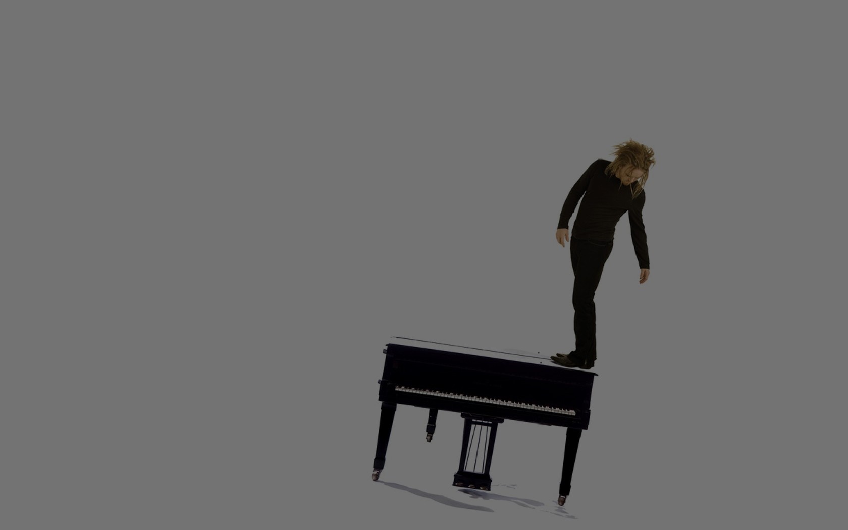 Man standing on a piano HD Wallpaper