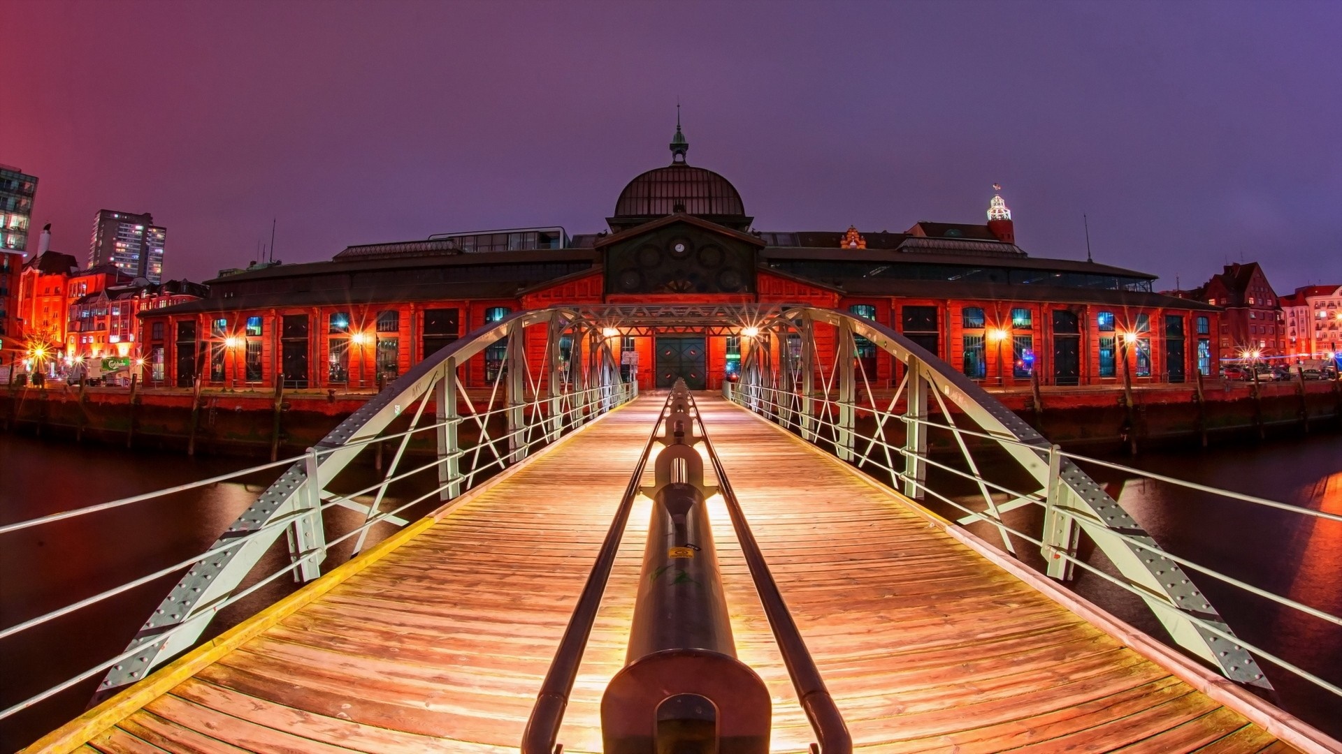 Bridge leading to historic building at night in Hamburg HD Wallpaper