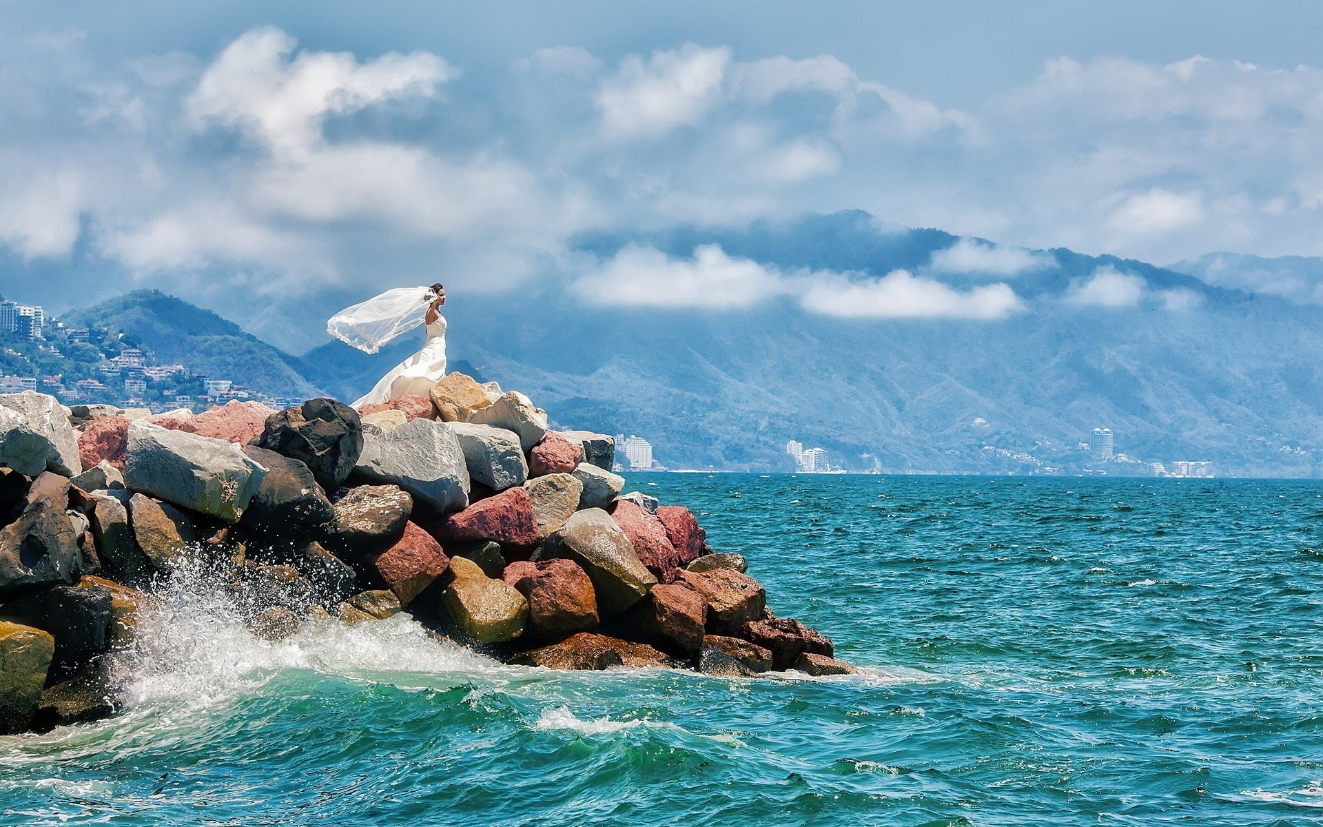 Bride on rocks by the sea with mountains HD Wallpaper