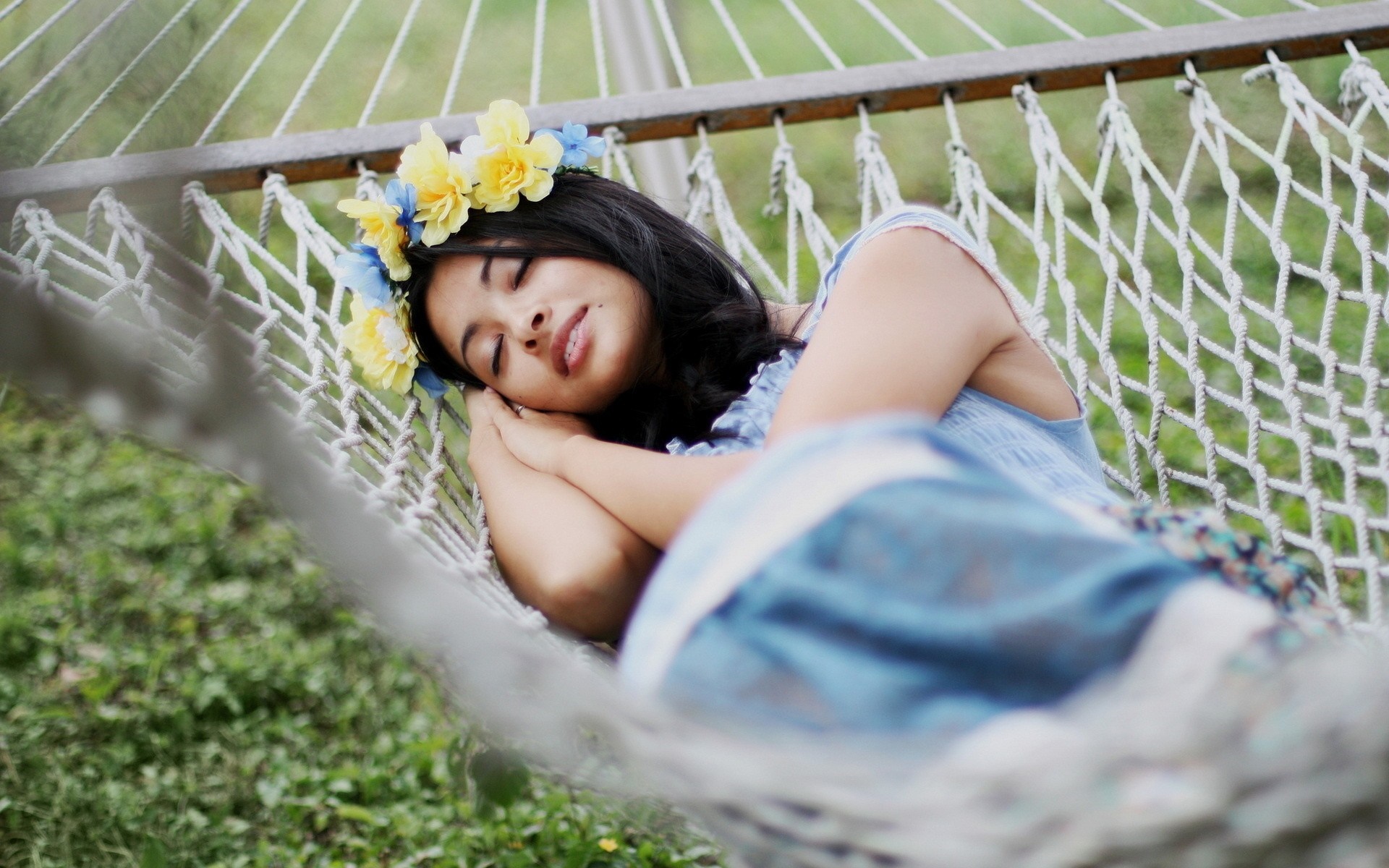 Woman wearing a flower crown sleeping in a hammock HD Wallpaper