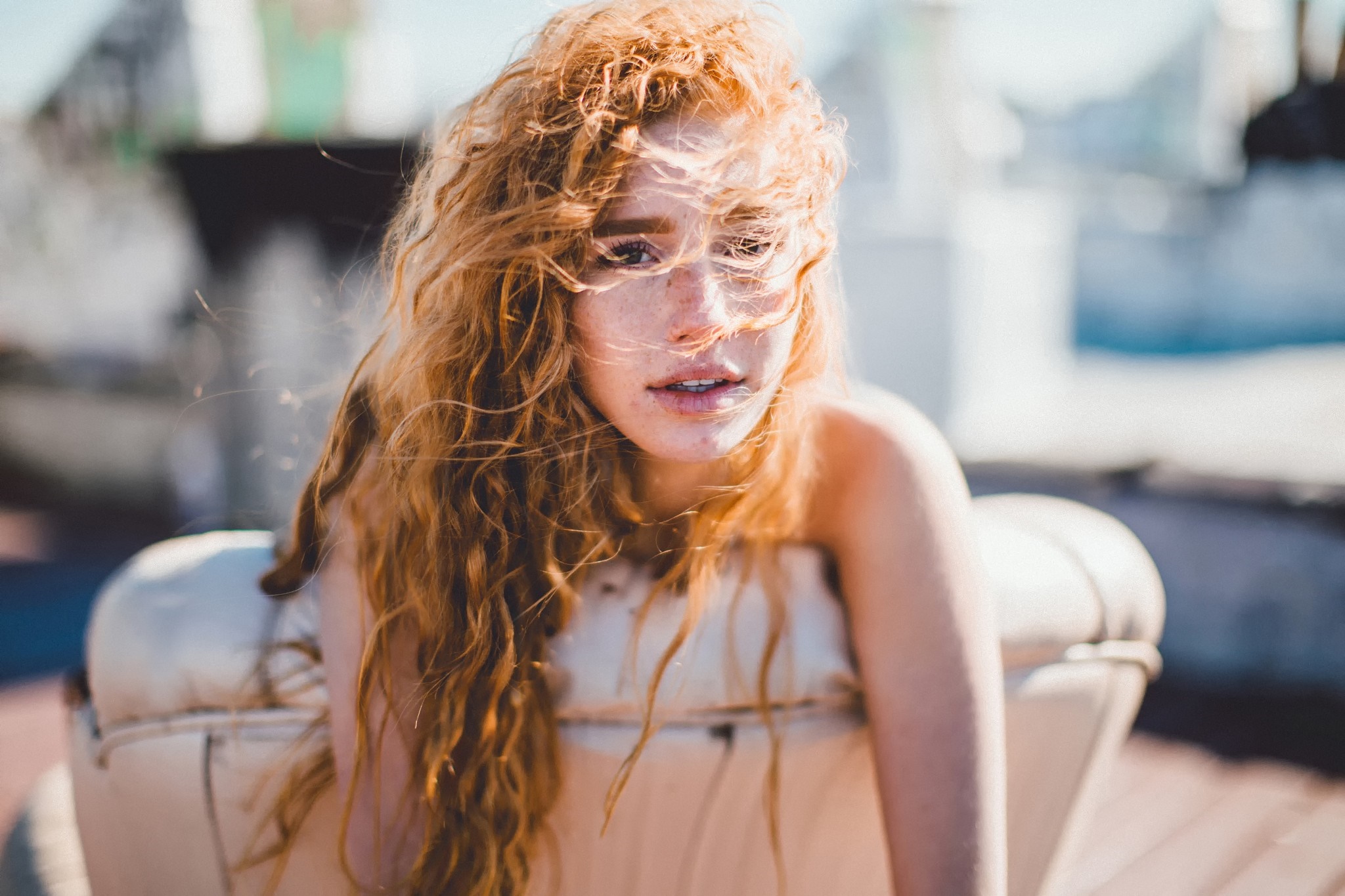 Woman with red curly hair outdoors HD Wallpaper