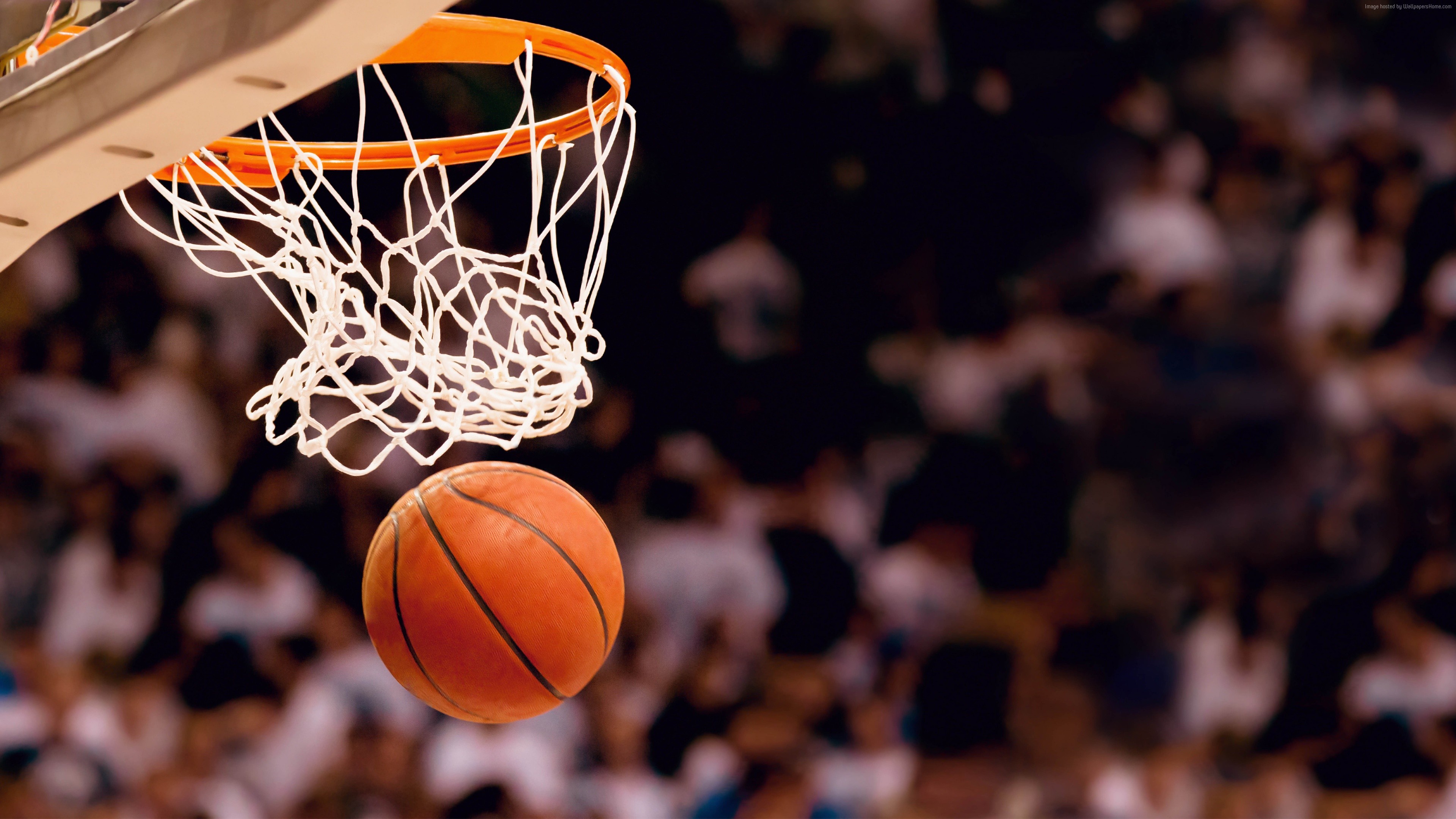 Basketball going into a hoop HD Wallpaper
