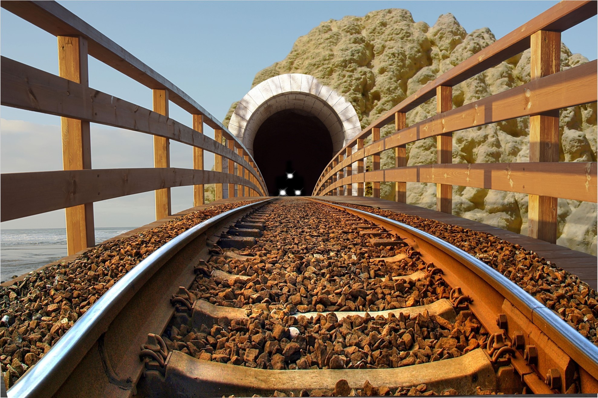 Train tracks leading to a tunnel entrance HD Wallpaper