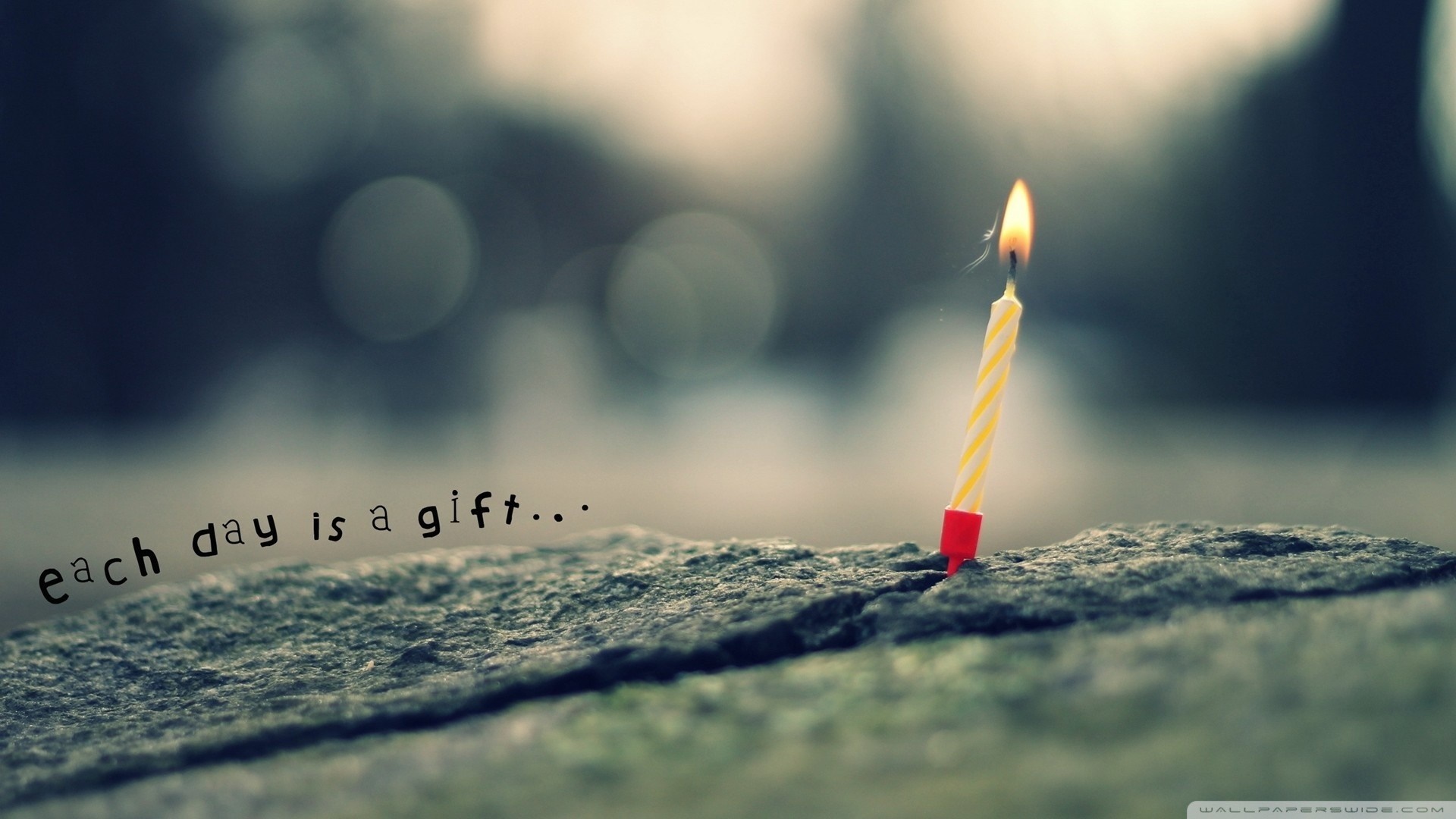 Birthday candle on a rock with text HD Wallpaper