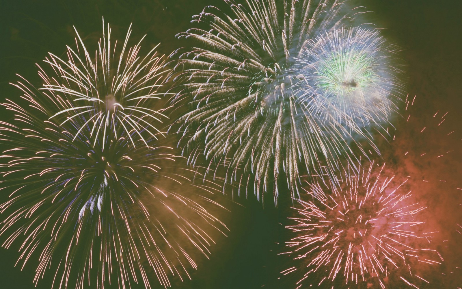 Fireworks exploding in the night sky HD Wallpaper