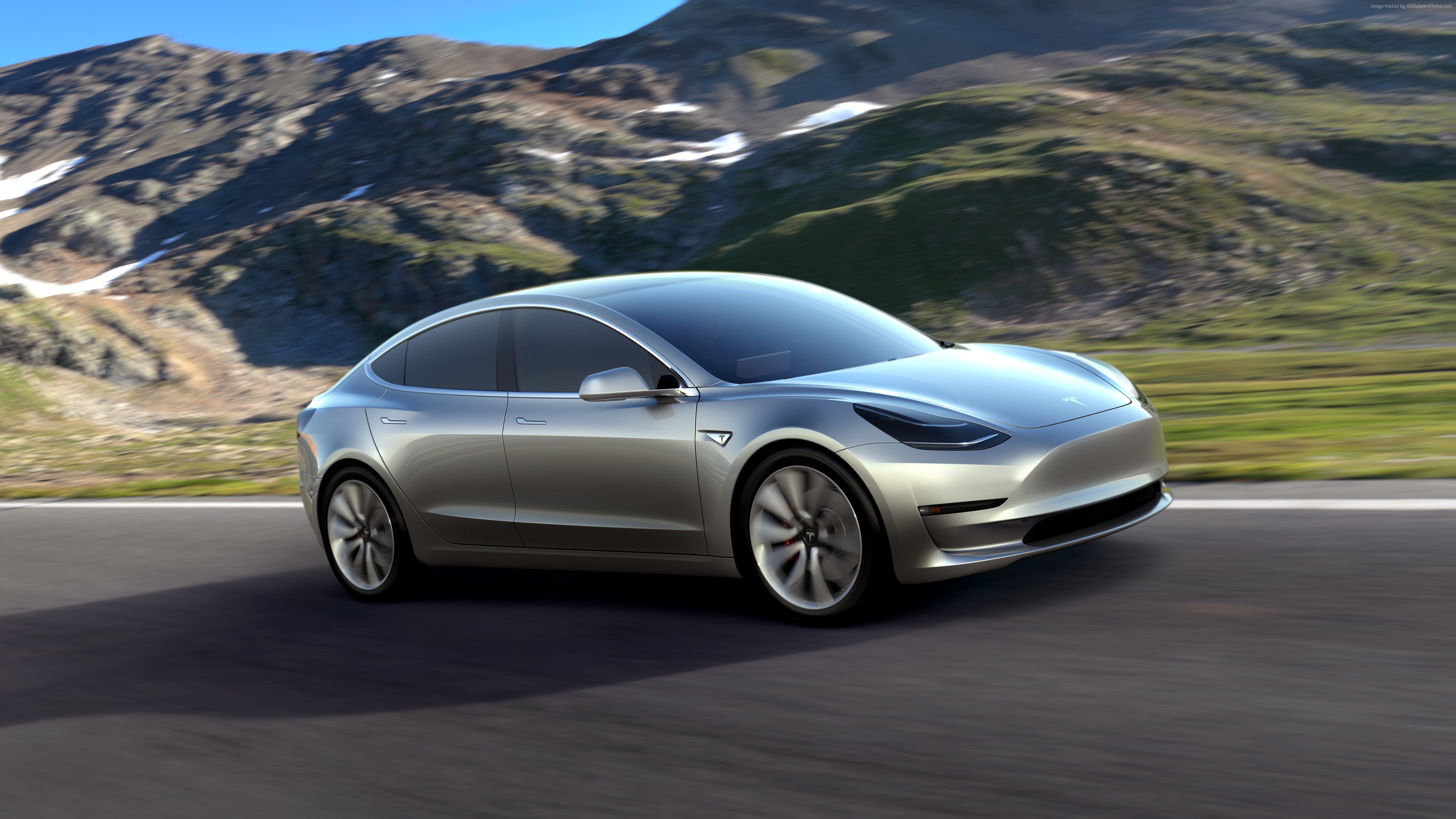 Silver Tesla Model 3 Prototype driving on a mountain road HD Wallpaper