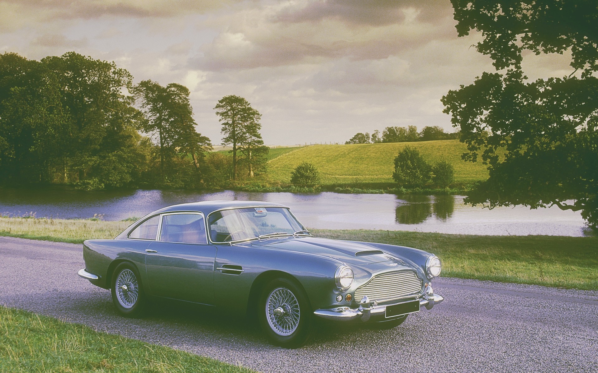 Aston Martin DB5 parked by a lake HD Wallpaper