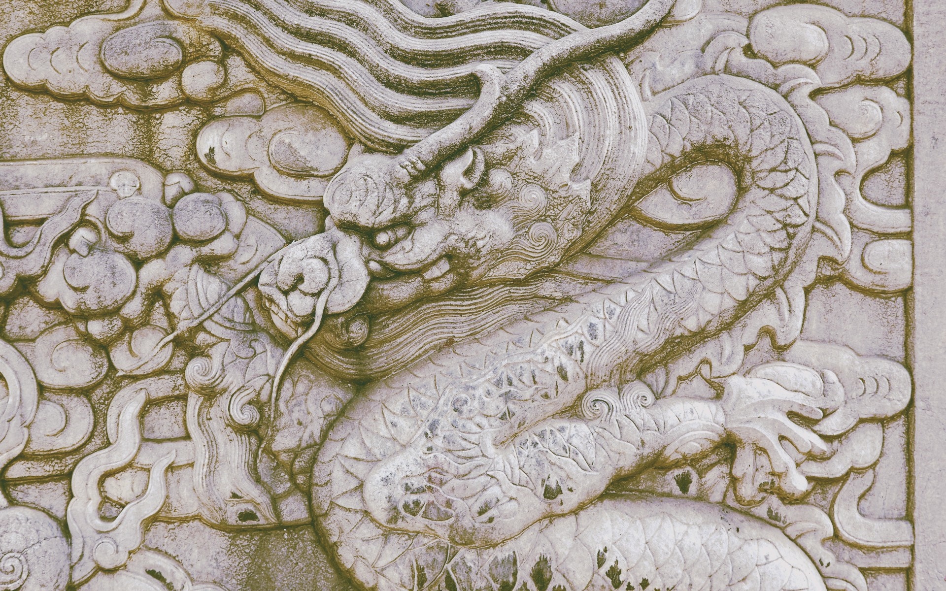 Stone carving of a Chinese dragon with clouds HD Wallpaper