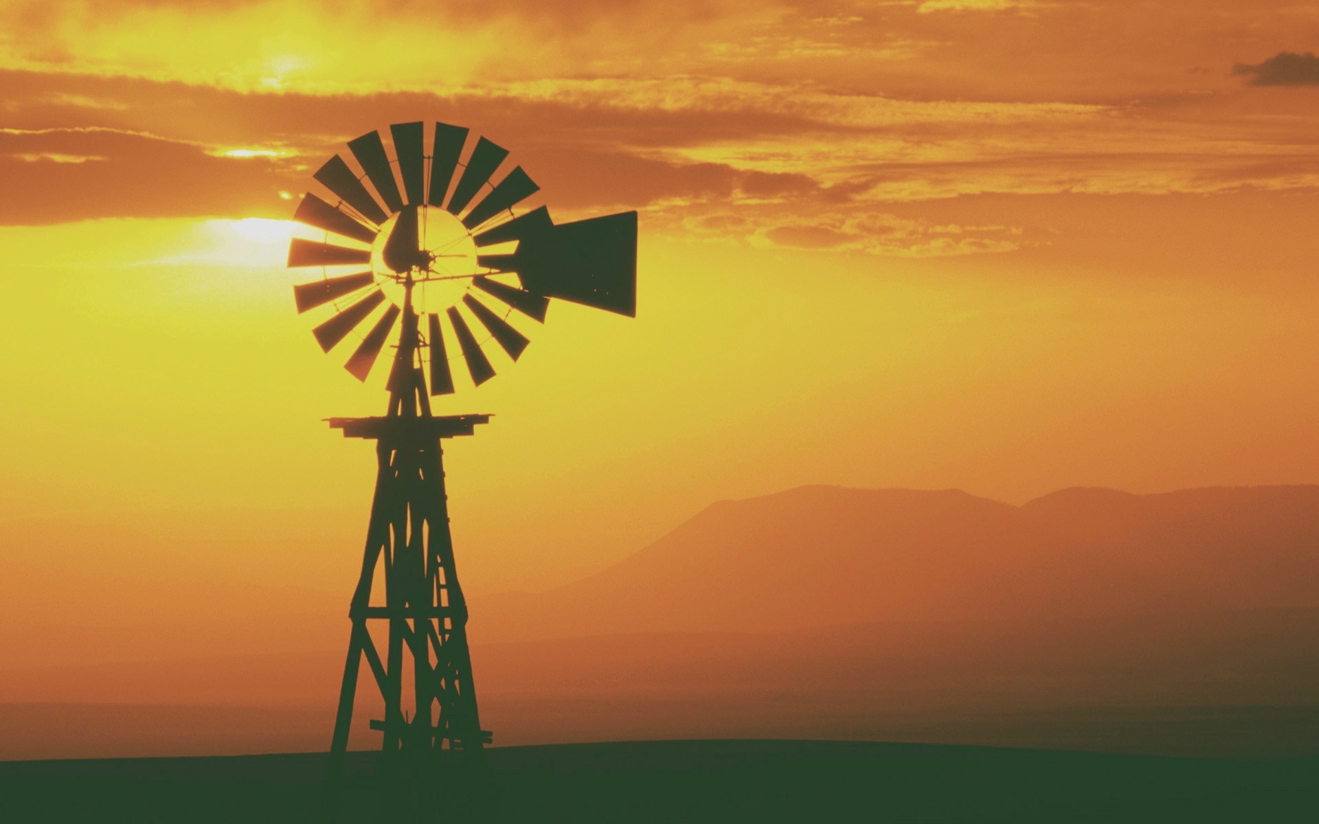 Silhouette of a windmill at sunset HD Wallpaper