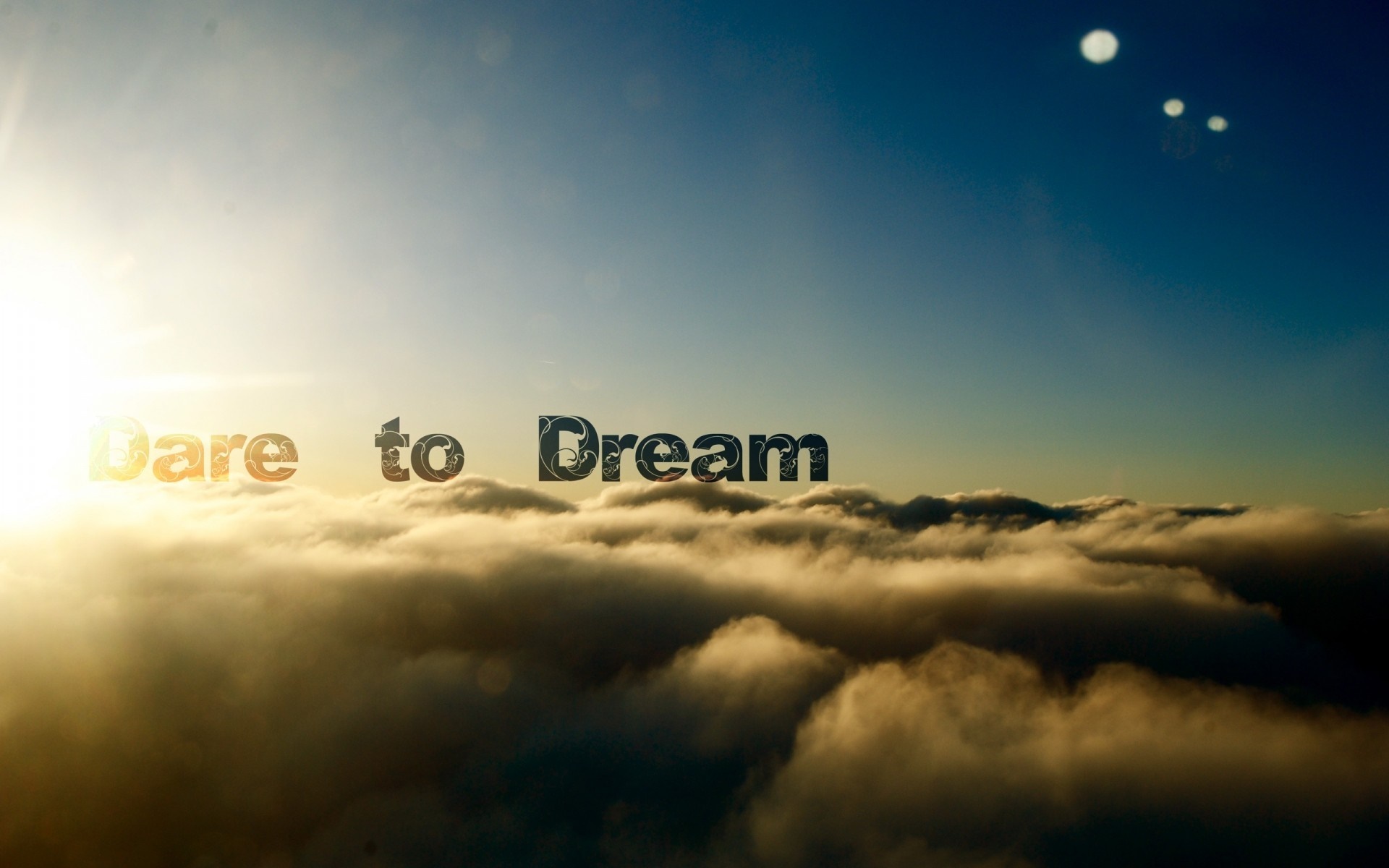Dare to Dream quote over clouds at sunrise HD Wallpaper