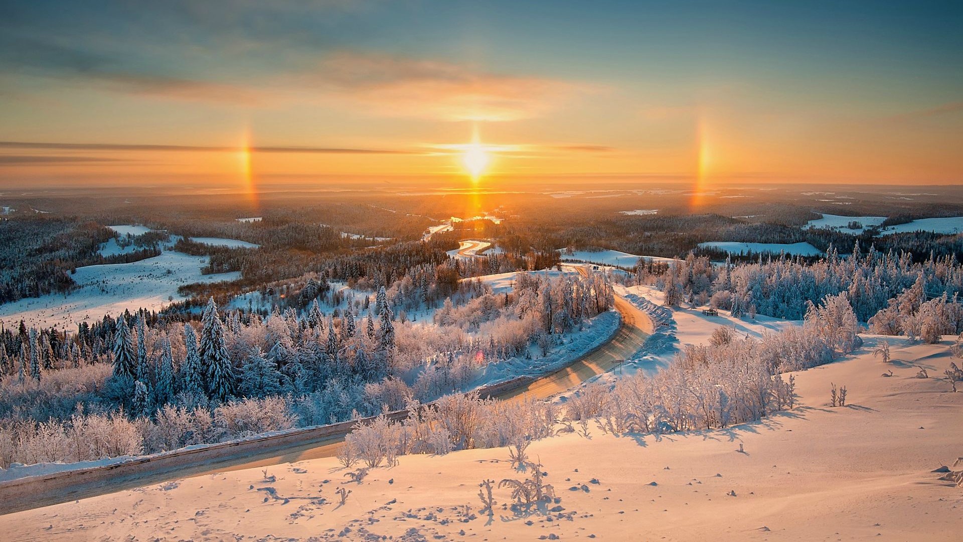 Winter landscape with sun dogs during sunset HD Wallpaper