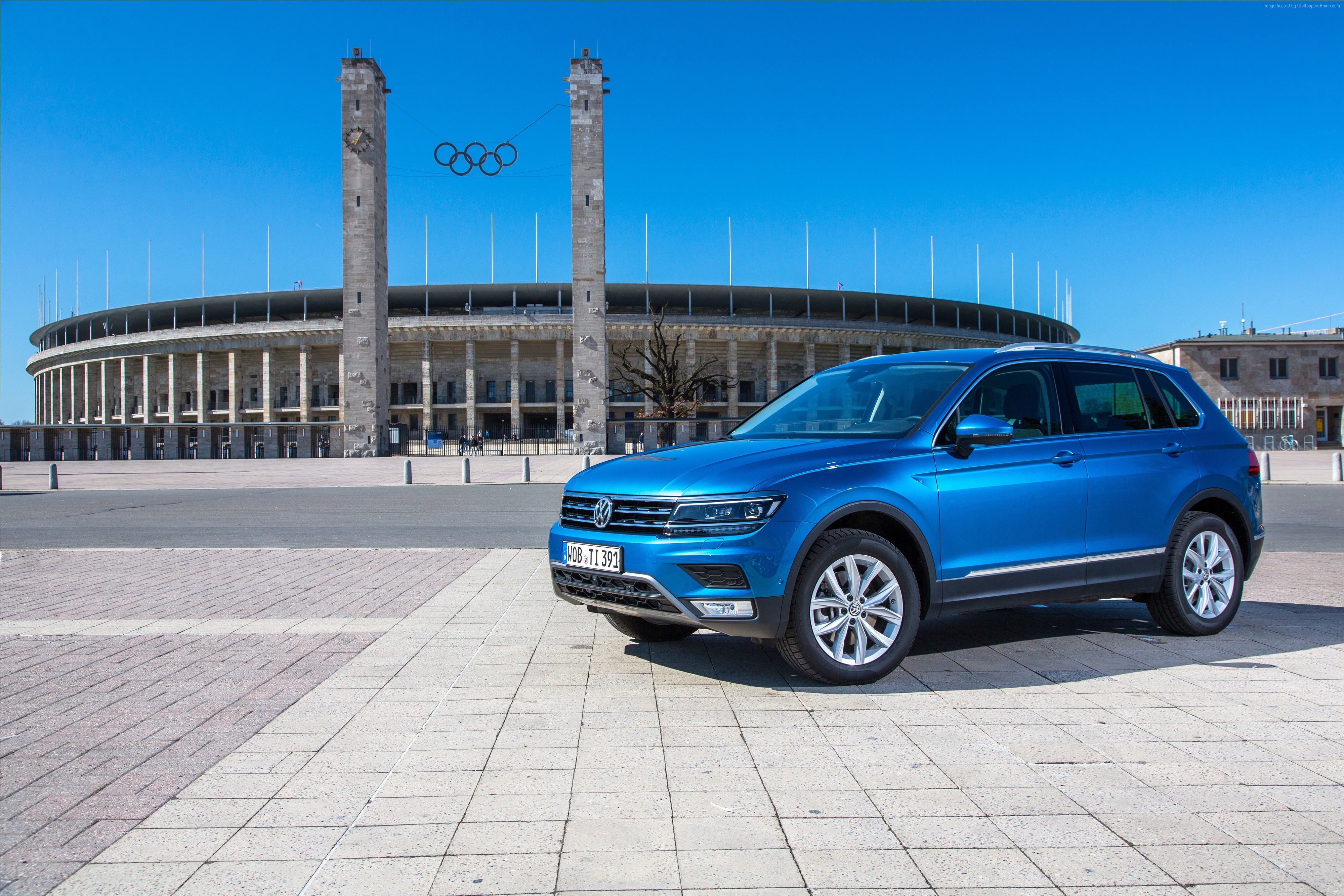 Blue Volkswagen Tiguan parked in front of Olympic Stadium HD Wallpaper