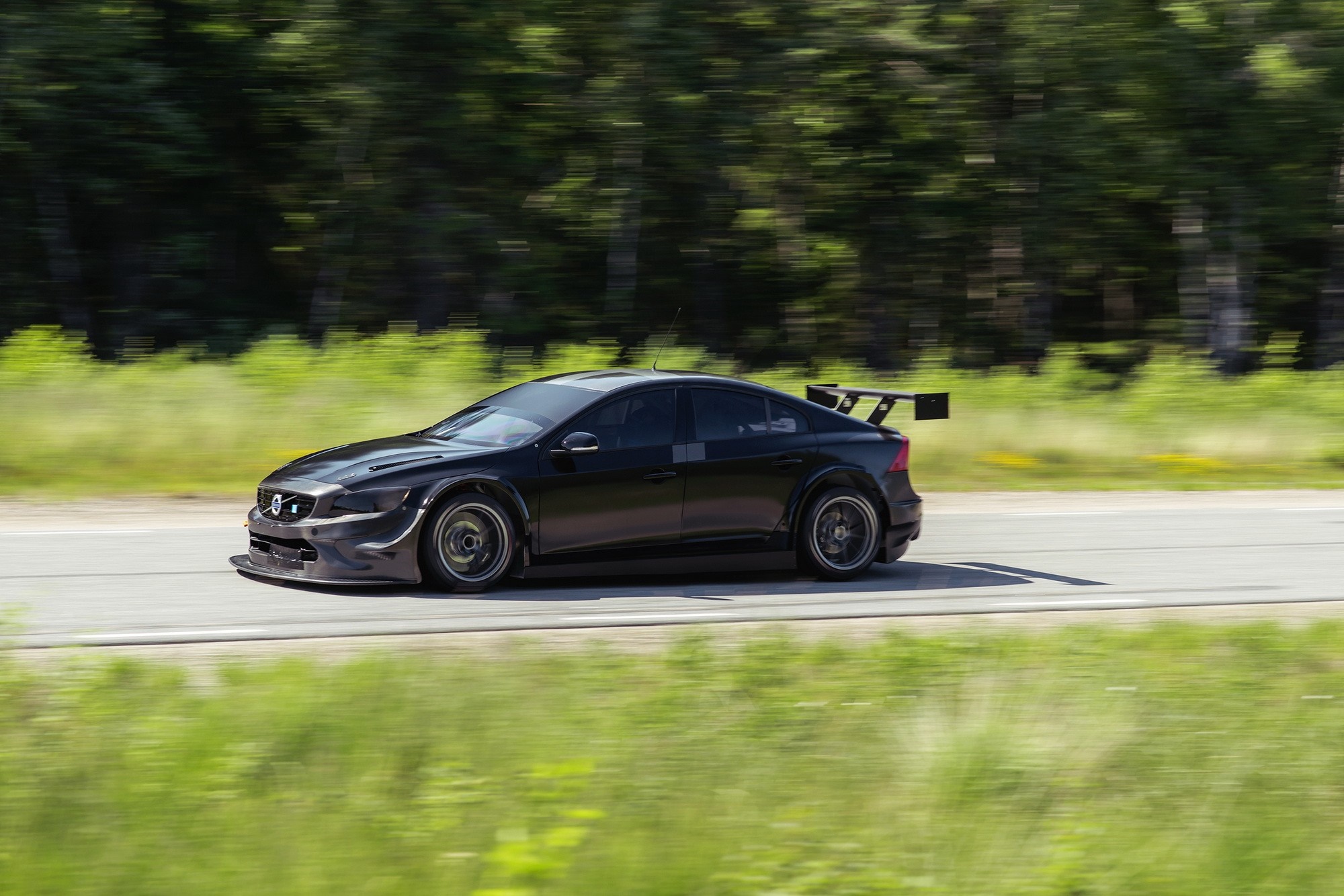 Black Volvo S60 WTCC race car with a large rear wing HD Wallpaper