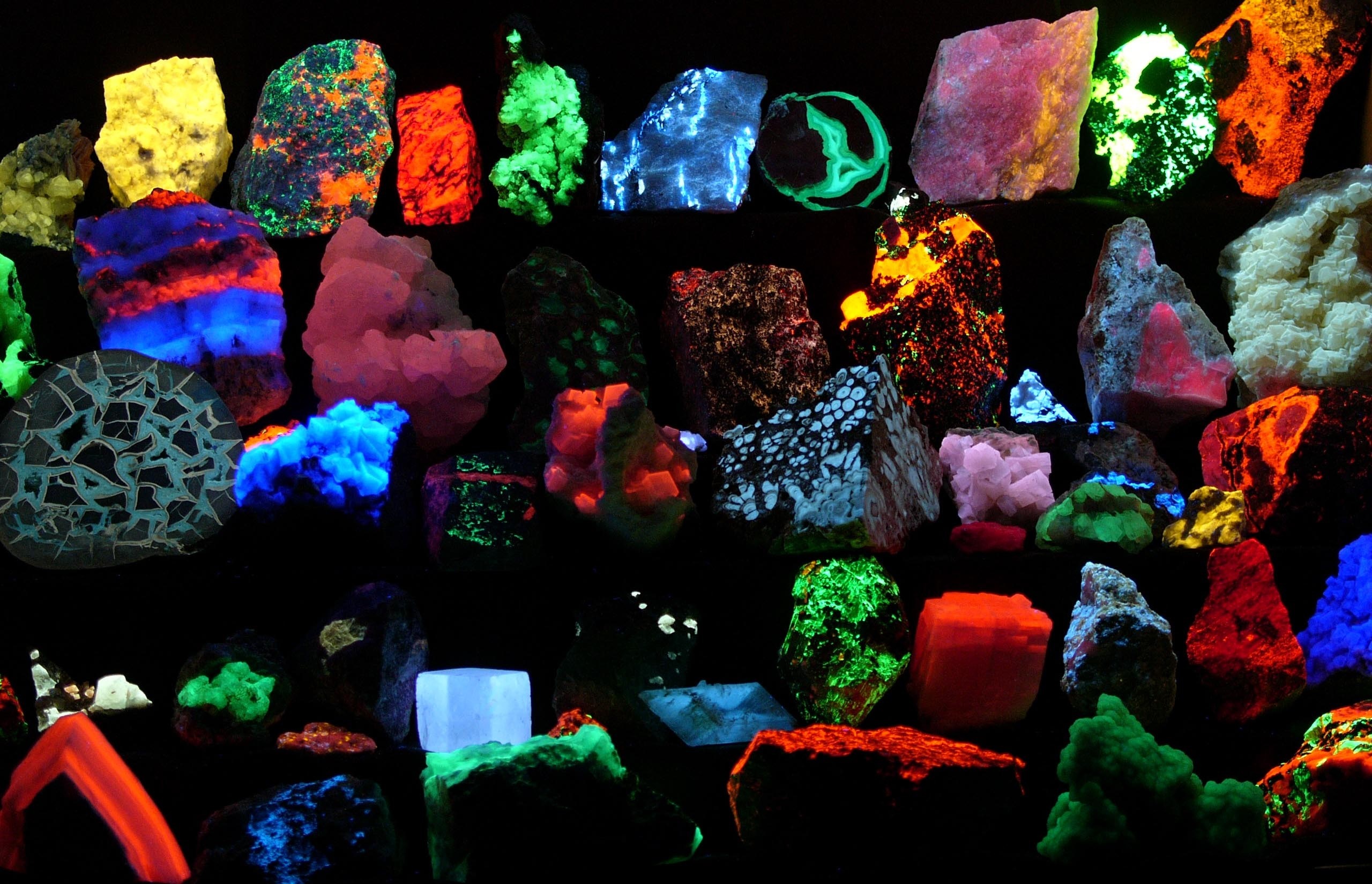 Collection of fluorescent minerals under UV light HD Wallpaper