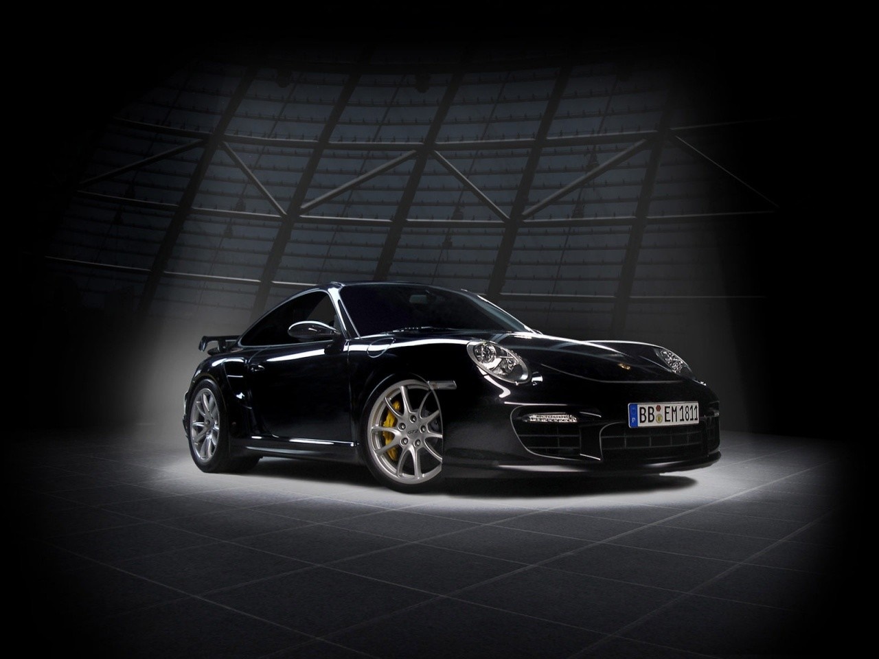 Black Porsche 911 GT2 in a dark garage HD Wallpaper