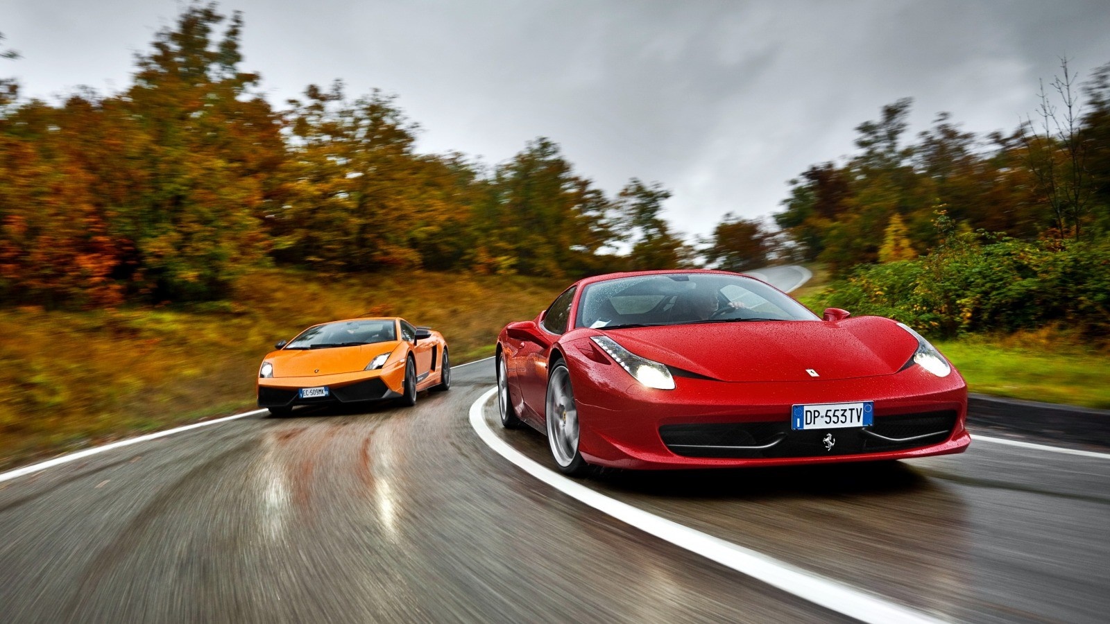 Ferrari 458 and Lamborghini Gallardo on a wet road HD Wallpaper