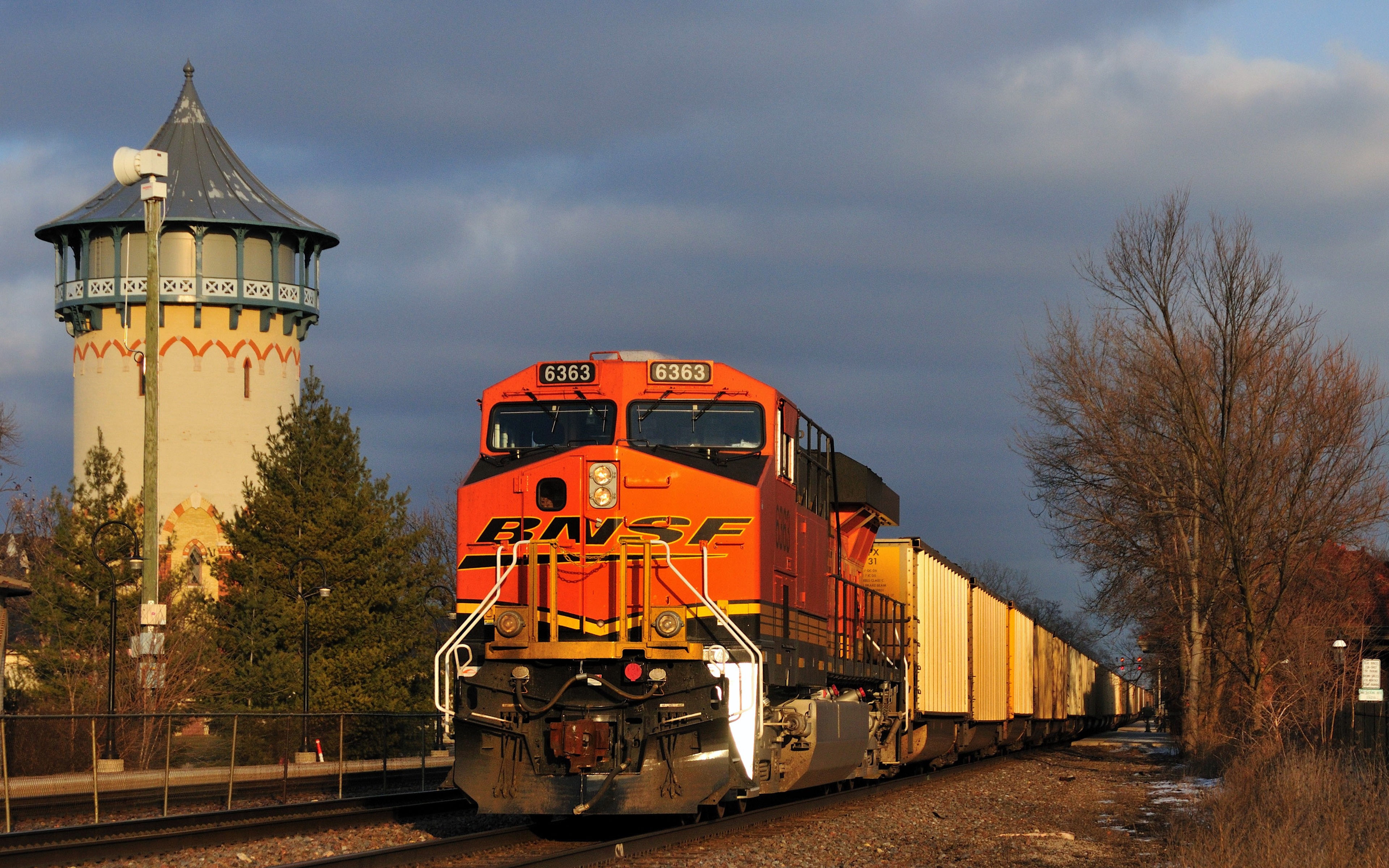 BNSF 6363 locomotive with freight train and water tower HD Wallpaper