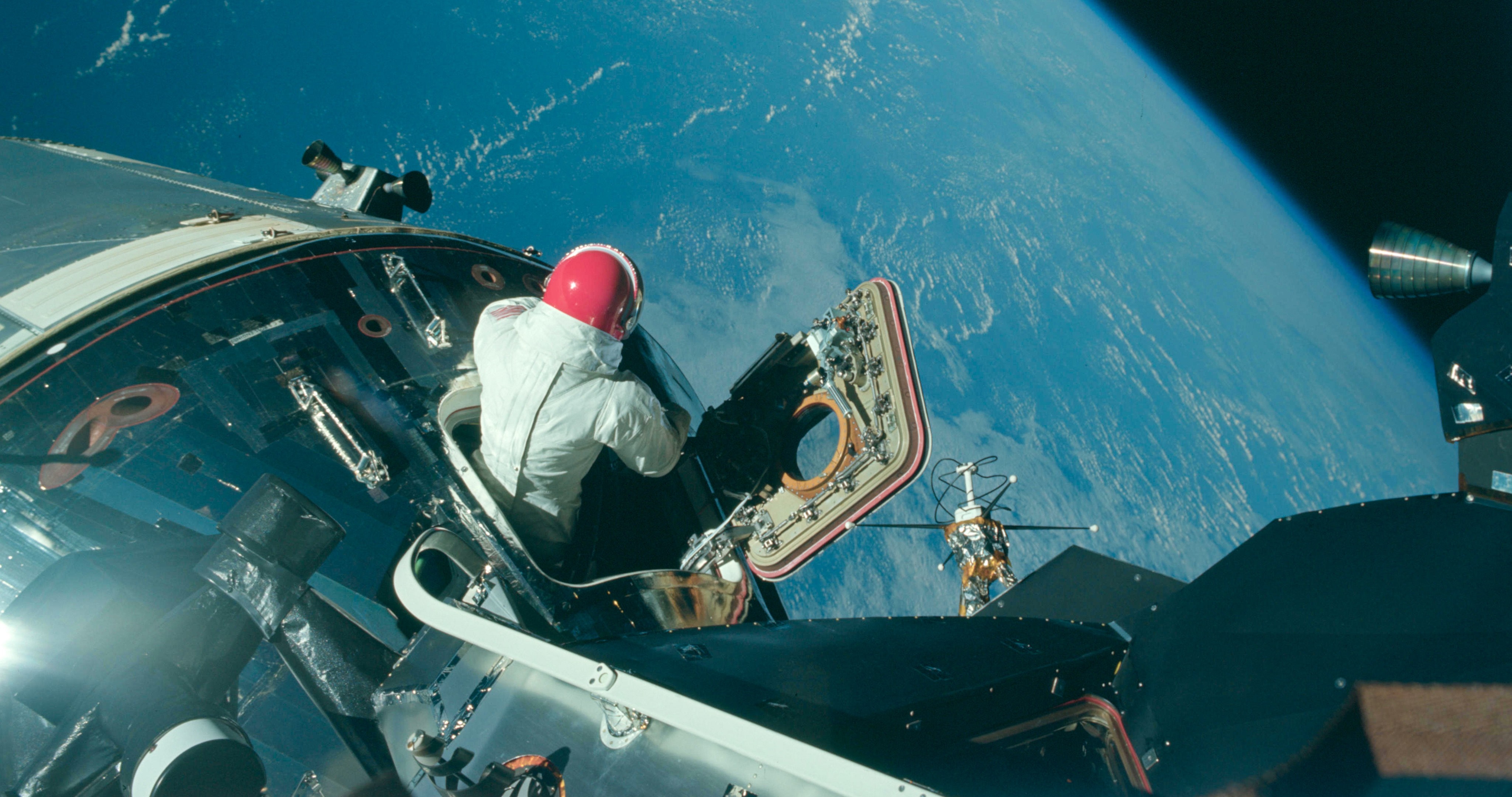 Astronaut in a spacecraft during an Apollo mission HD Wallpaper