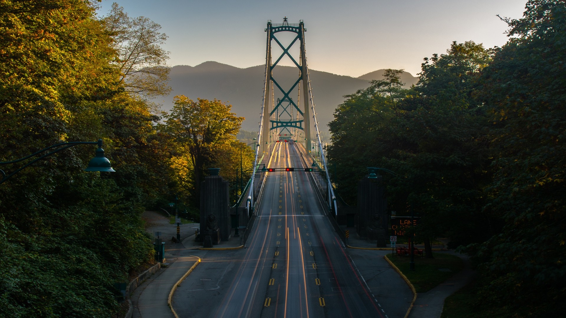 Lions Gate Bridge at sunset with light trails HD Wallpaper