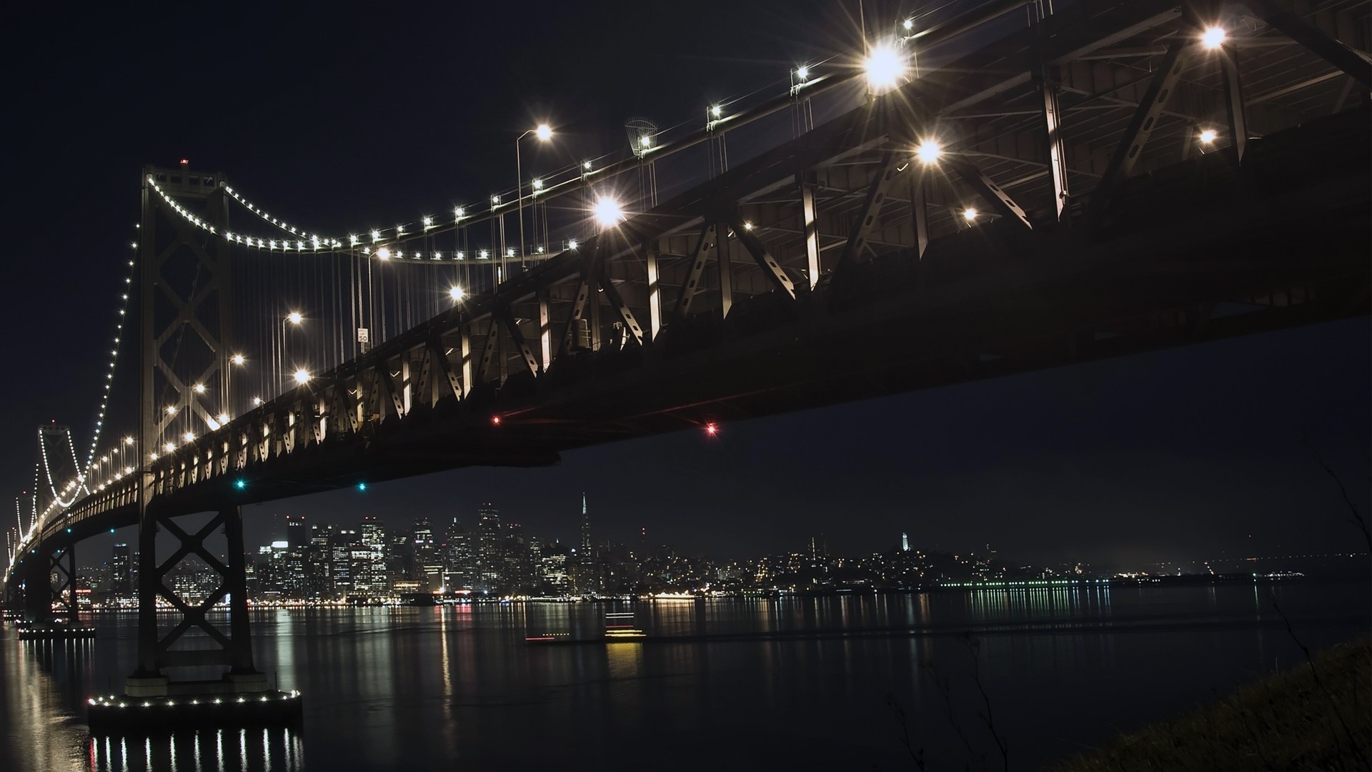 Bay Bridge at night with San Francisco skyline HD Wallpaper