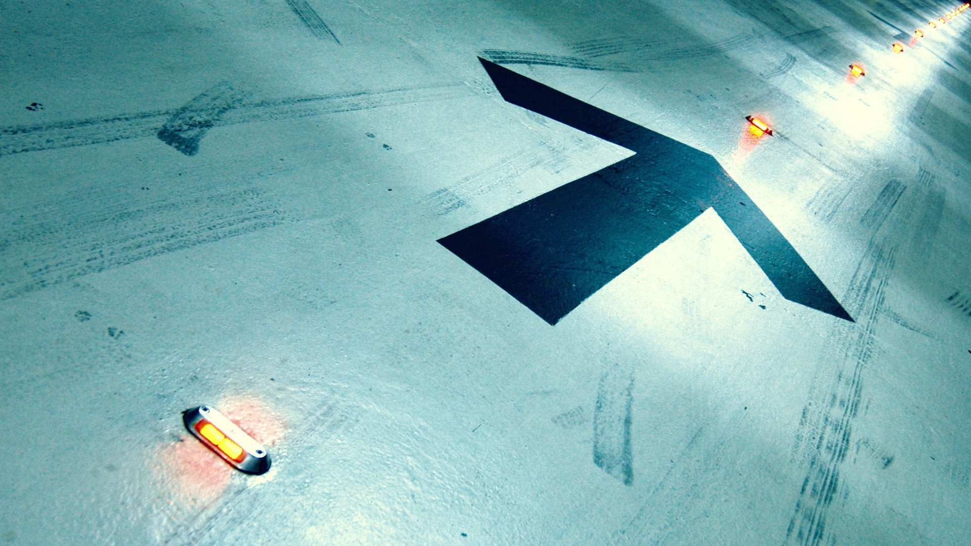 Arrow on a concrete floor with lights HD Wallpaper