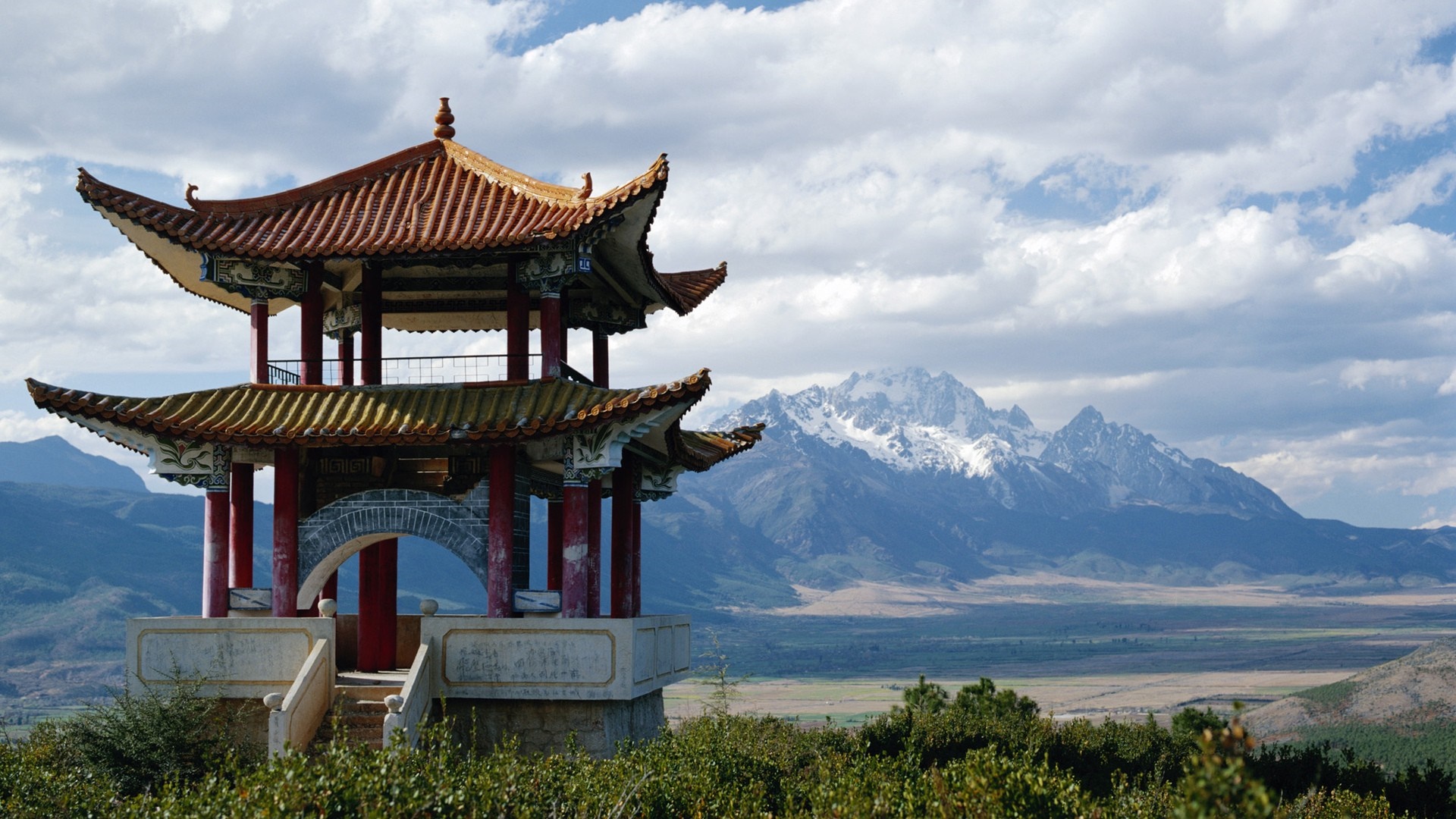 Pagoda overlooking snow-capped mountains HD Wallpaper