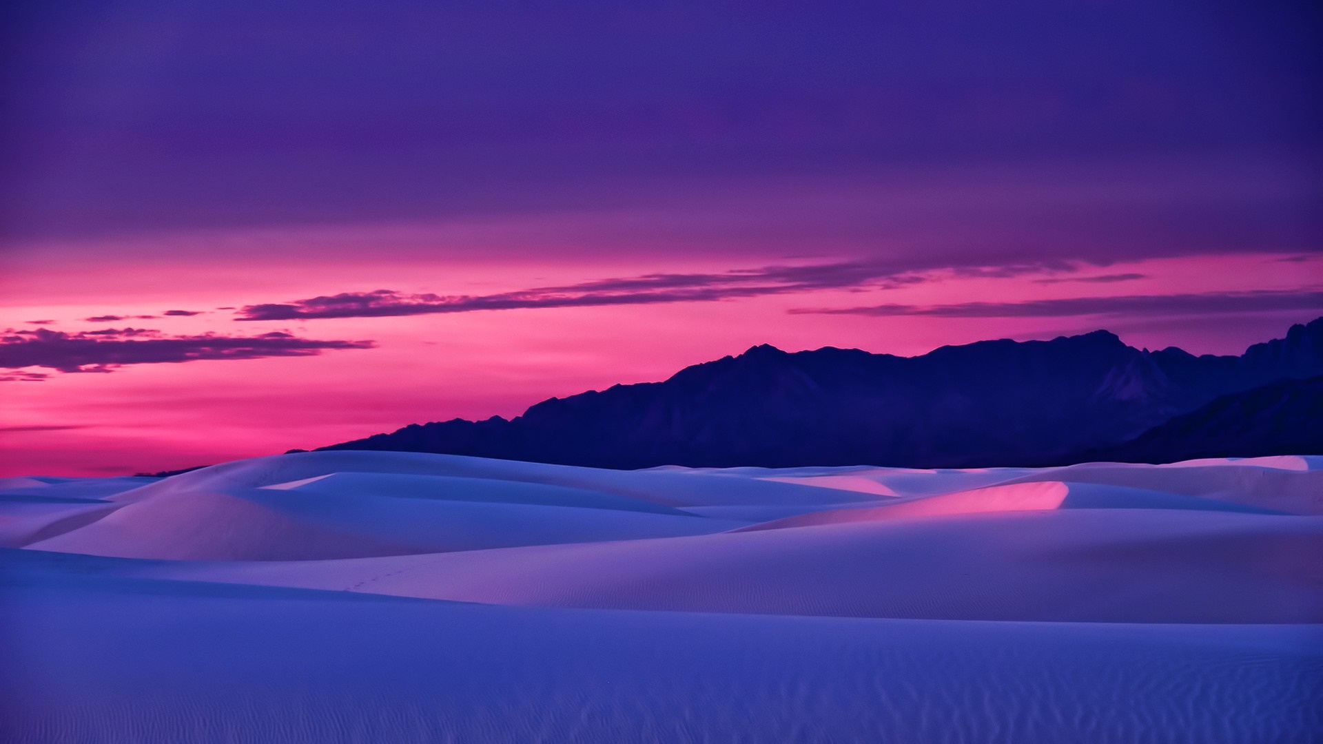 Desert sand dunes at sunset with mountains HD Wallpaper