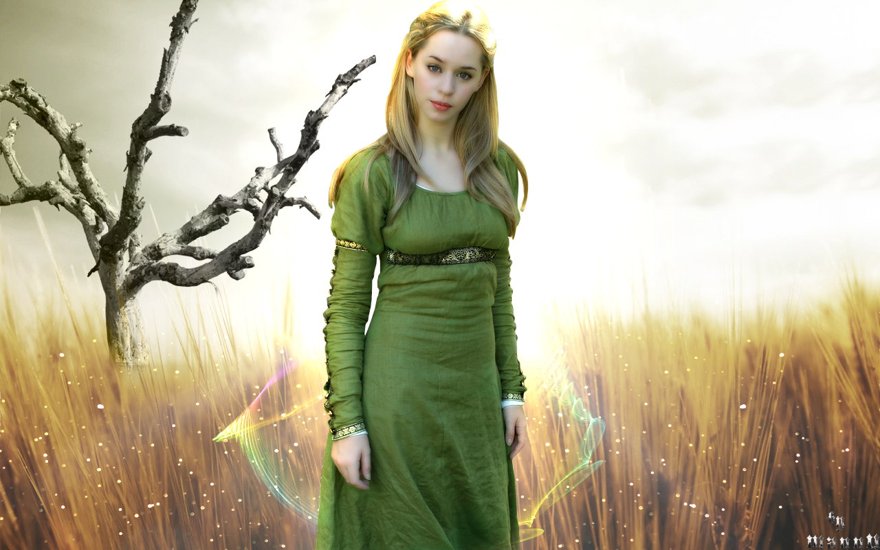 Woman in green dress in a field with a dead tree HD Wallpaper