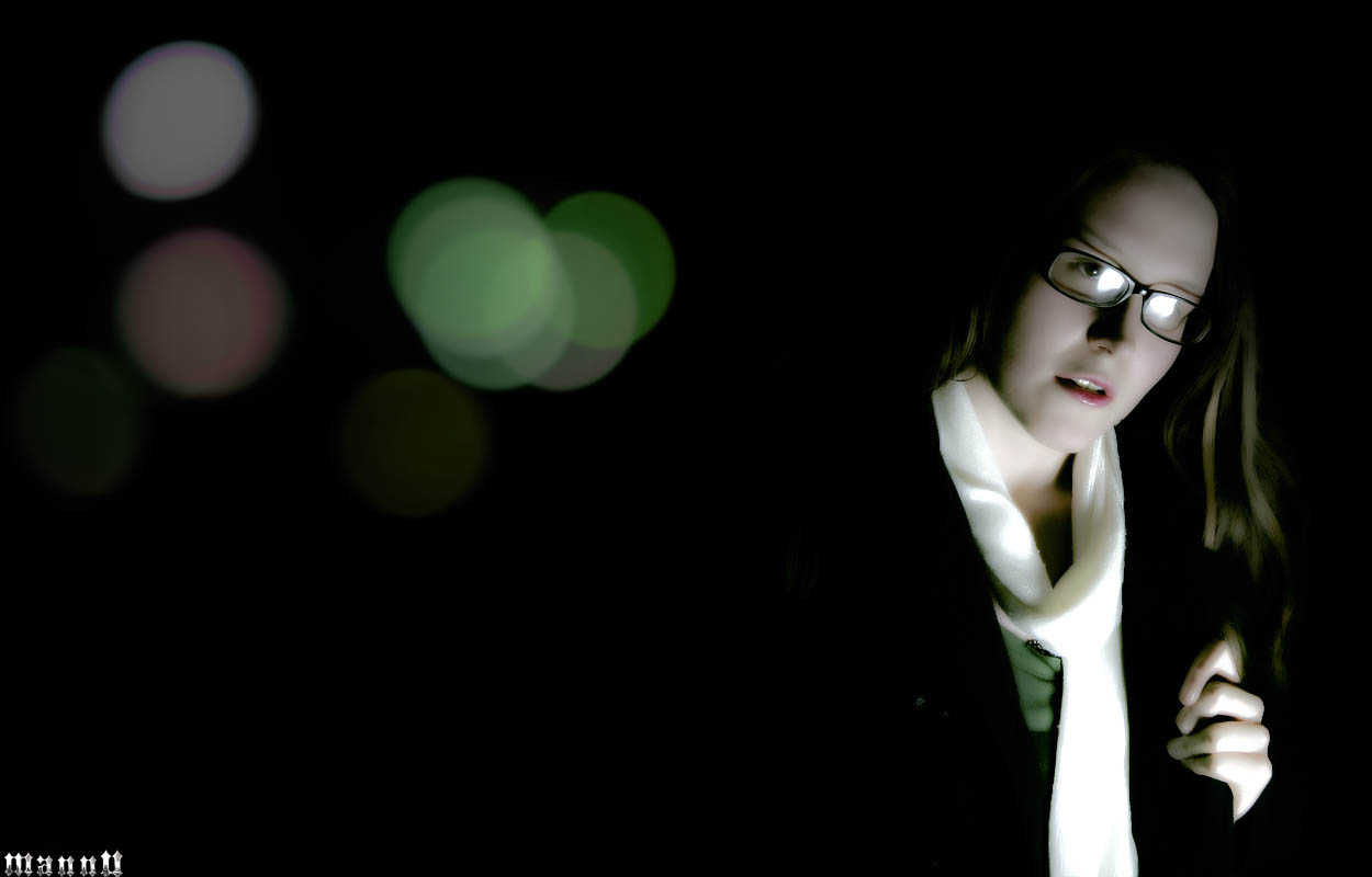Woman with glasses and scarf in darkness HD Wallpaper