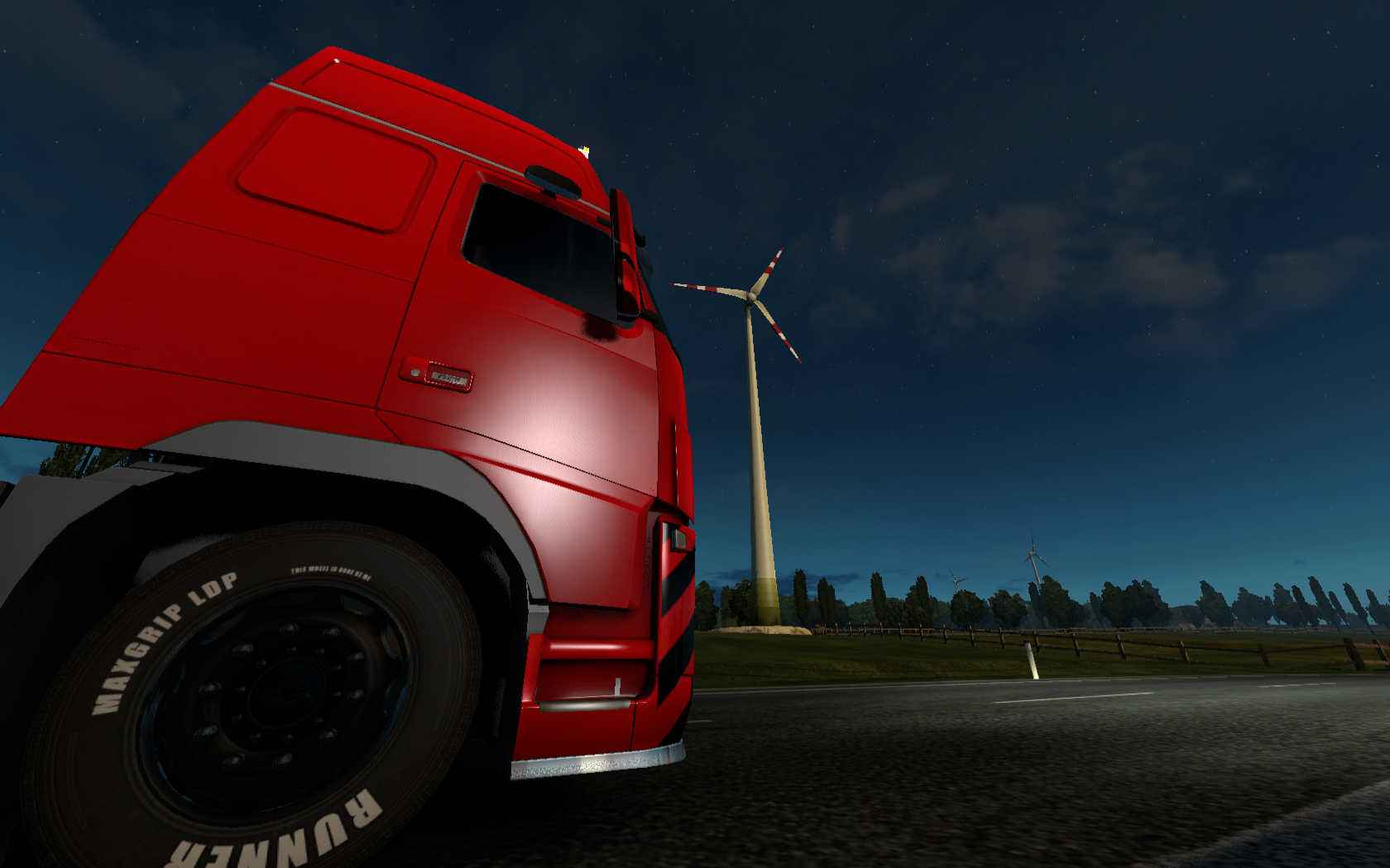 Red truck at night with wind turbines in Euro Truck Simulator 2 HD Wallpaper