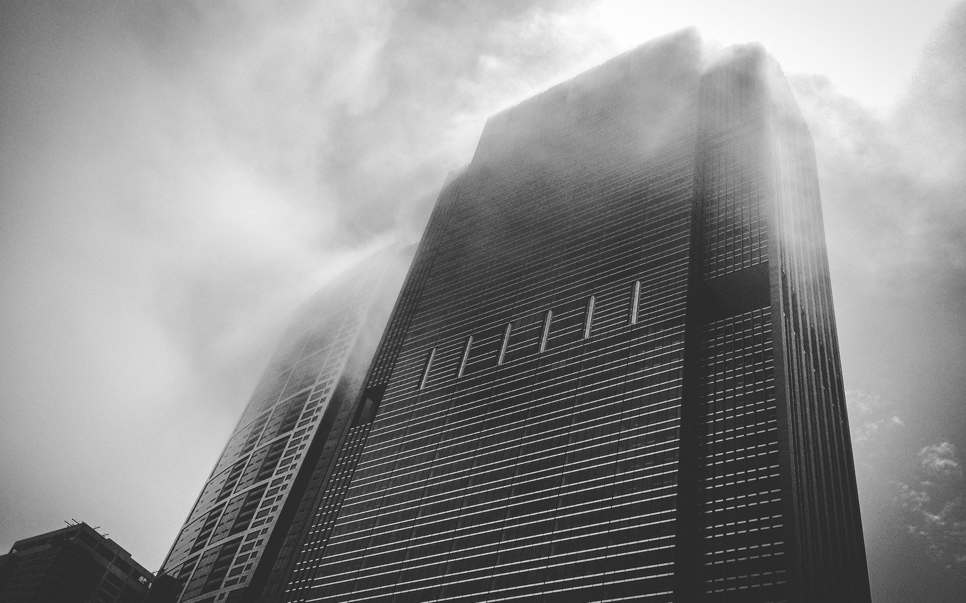 Monochrome skyscraper shrouded in mist HD Wallpaper
