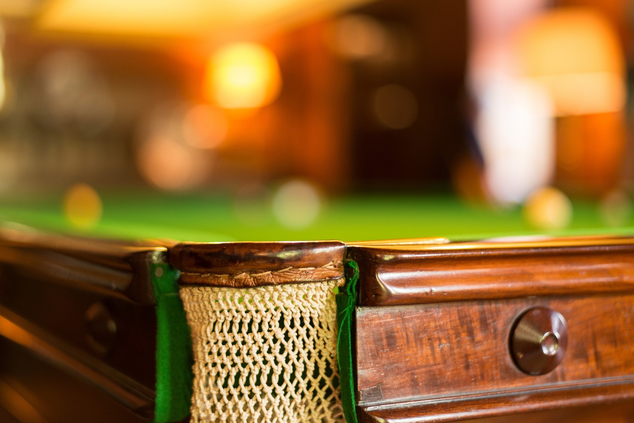 Close-up of a pool table corner with a net pocket HD Wallpaper