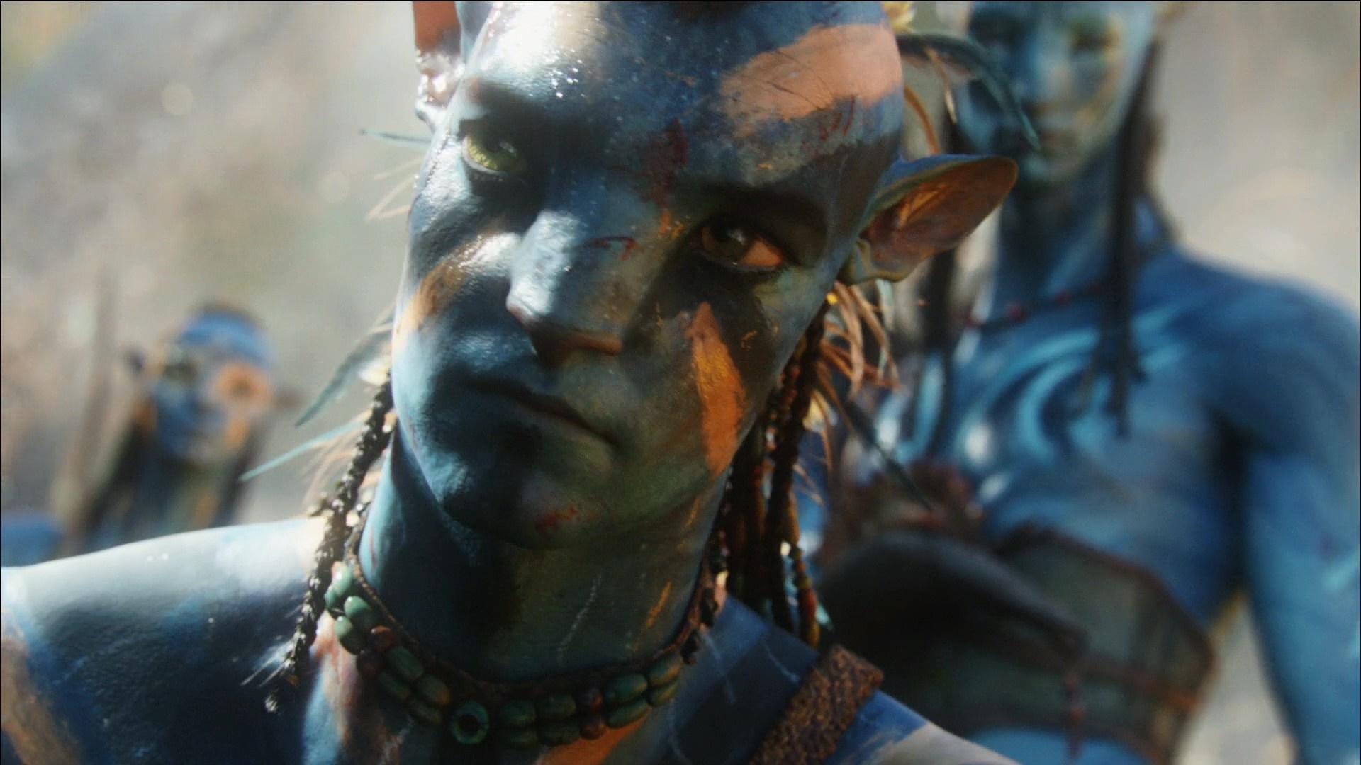 Avatar character with blue skin and tribal markings HD Wallpaper